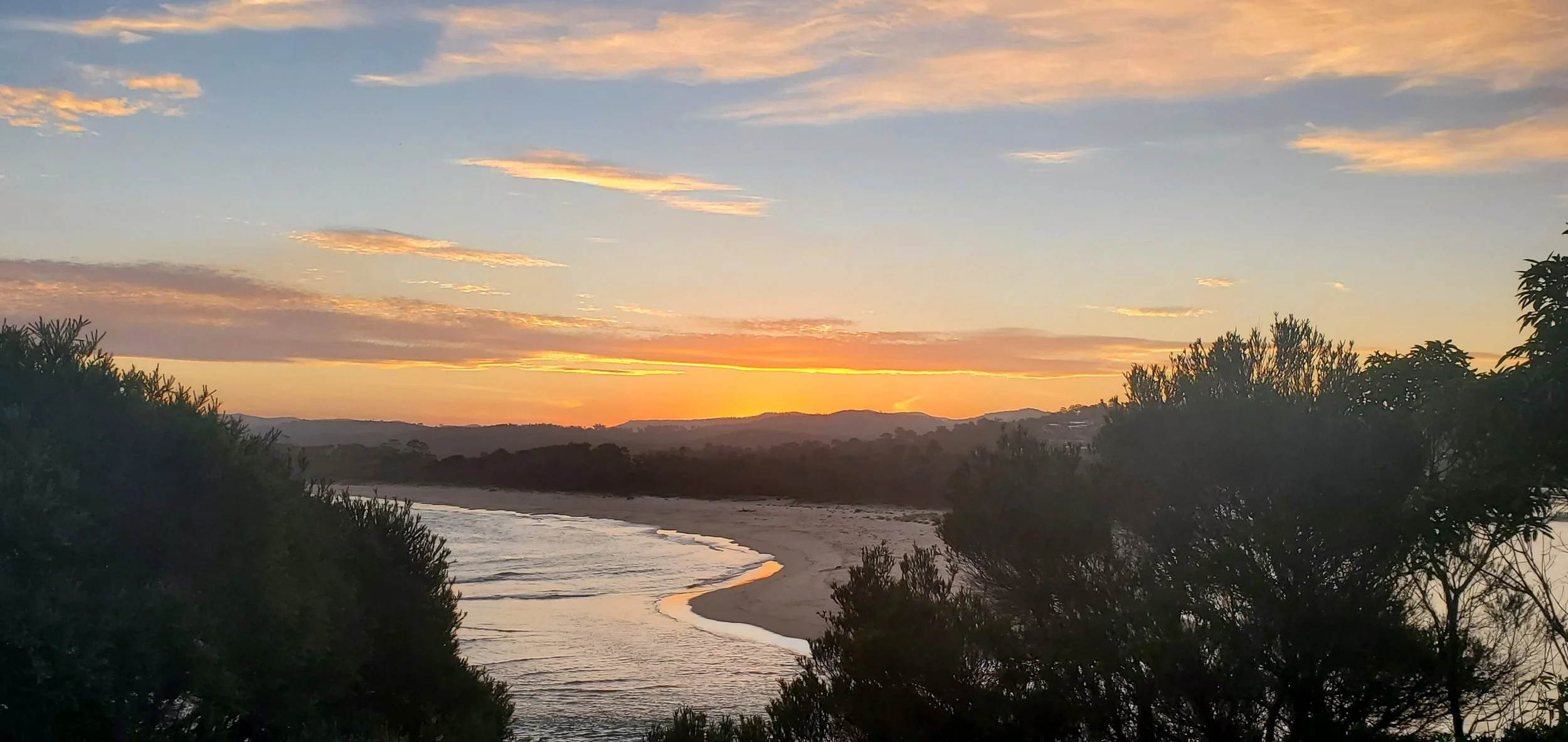 Photo of a sunset over a beach