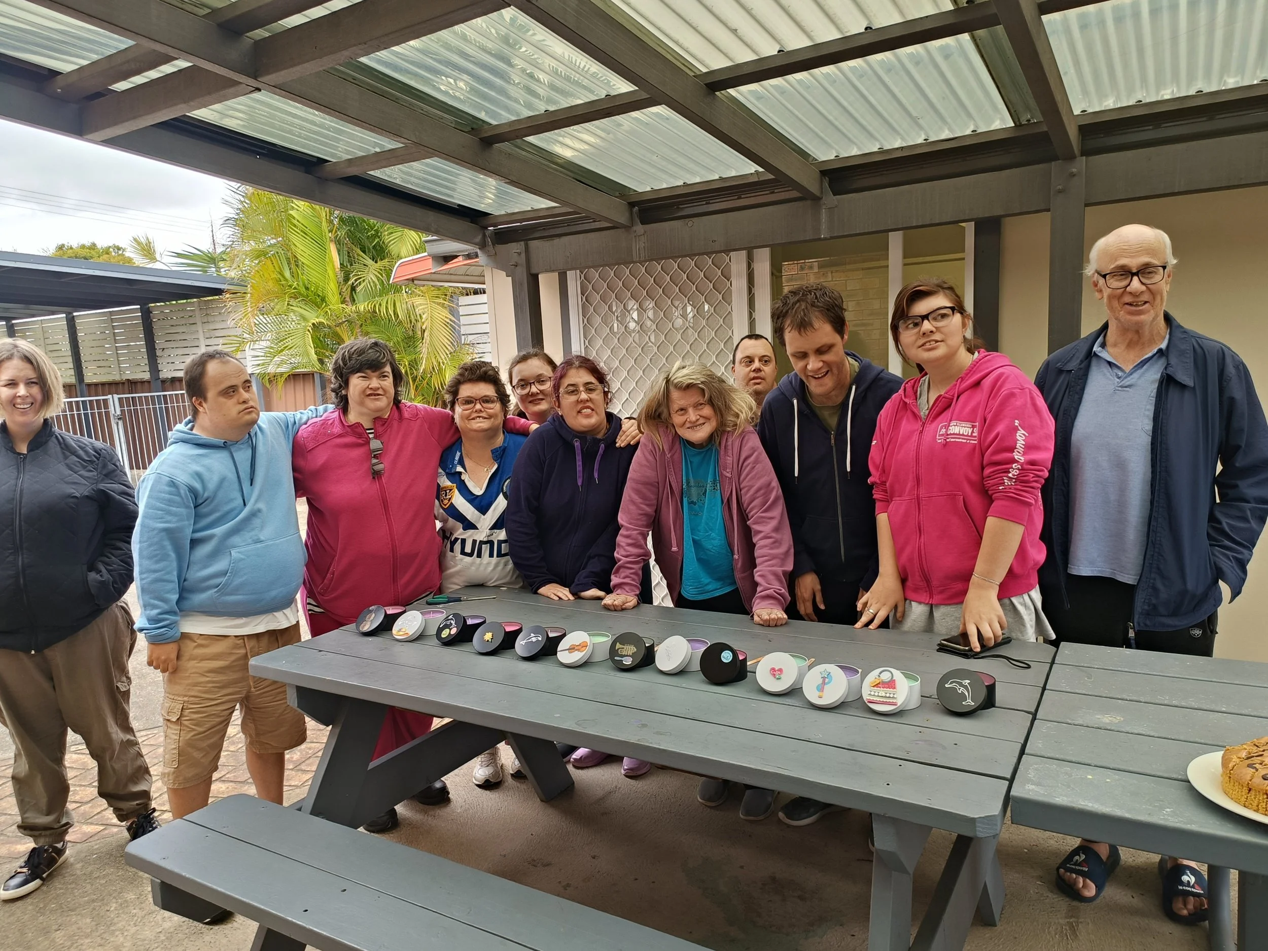 Group of participants and the candles they have made