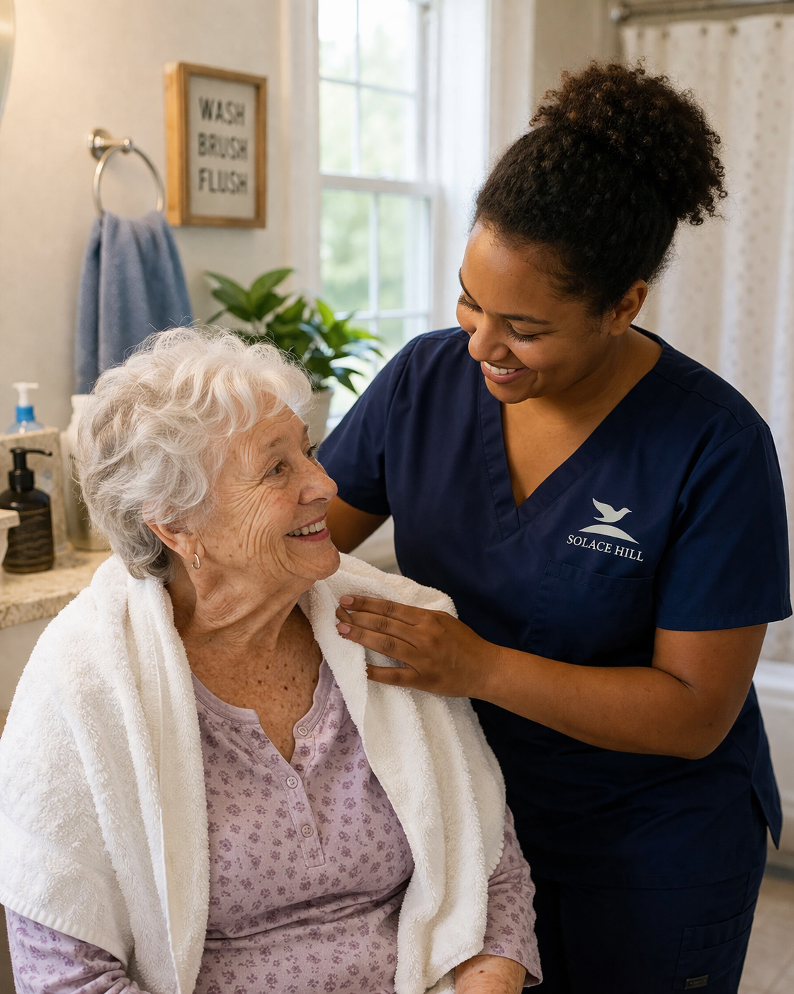 A young female healthcare worker with dark hair tied back, wearing a green scrub, helping an elderly woman with white hair, wearing a beige sweater, with a hand sanitizer pump in her hand in a bright room.