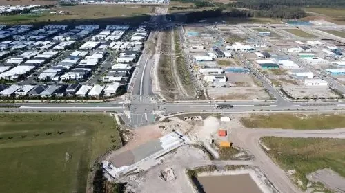 An aerial view of road construction in a residential area.