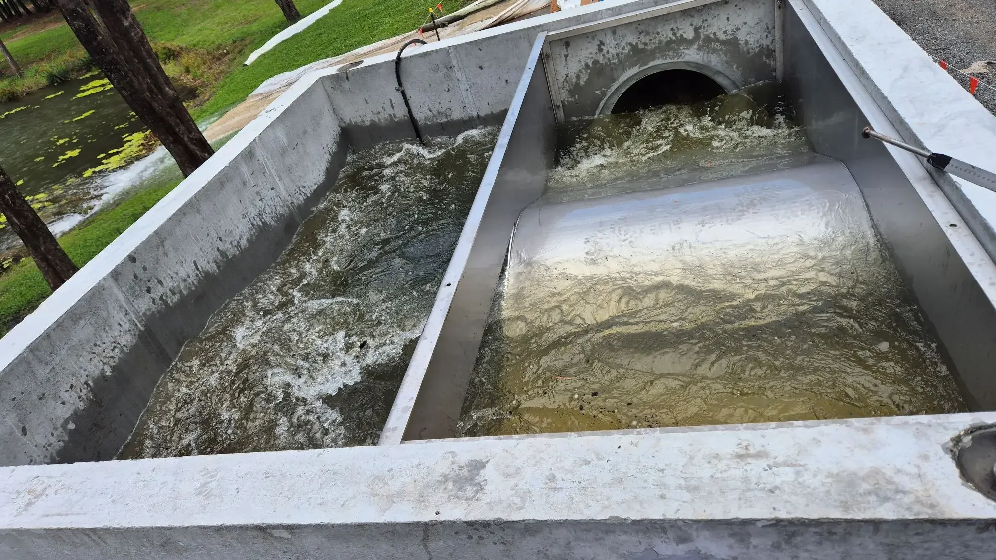 Stormwater treatment system managing water flow through civil drainage infrastructure