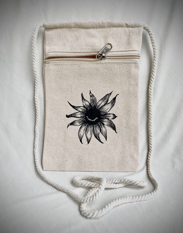 Canvas crossbody pouches featuring a smiling sunflower graphic in black and natural colors.