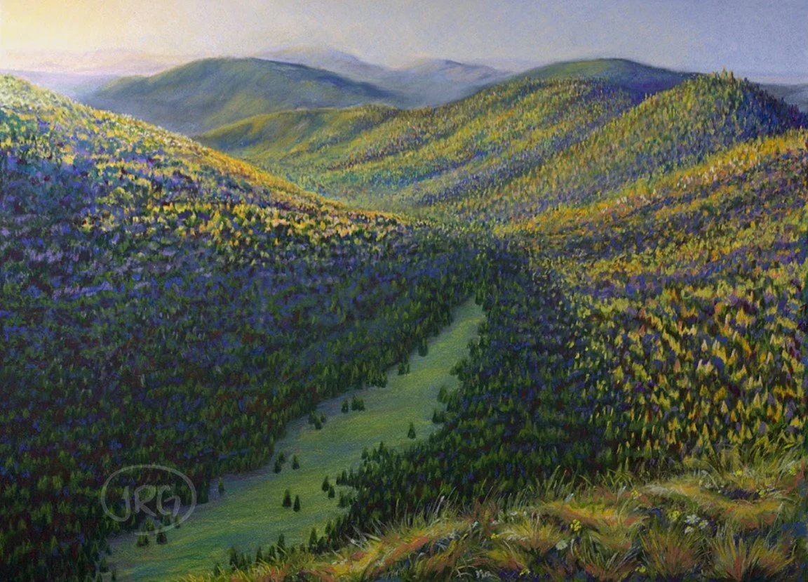 Pastel landscape of layered forested mountains with a winding green valley below.