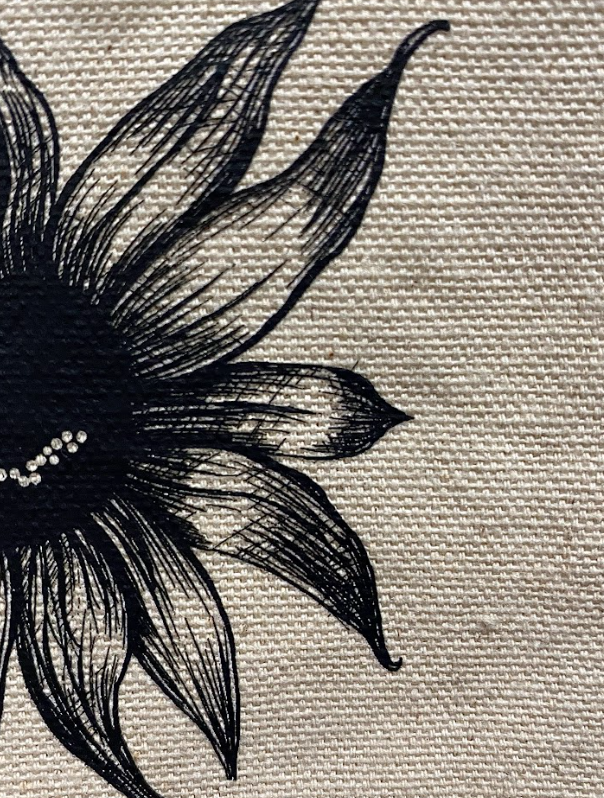 Canvas crossbody pouches featuring a smiling sunflower graphic in black and natural colors.