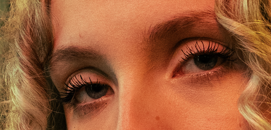 Close-up of a person's eyes with light makeup, including mascara and light eyeshadow.
