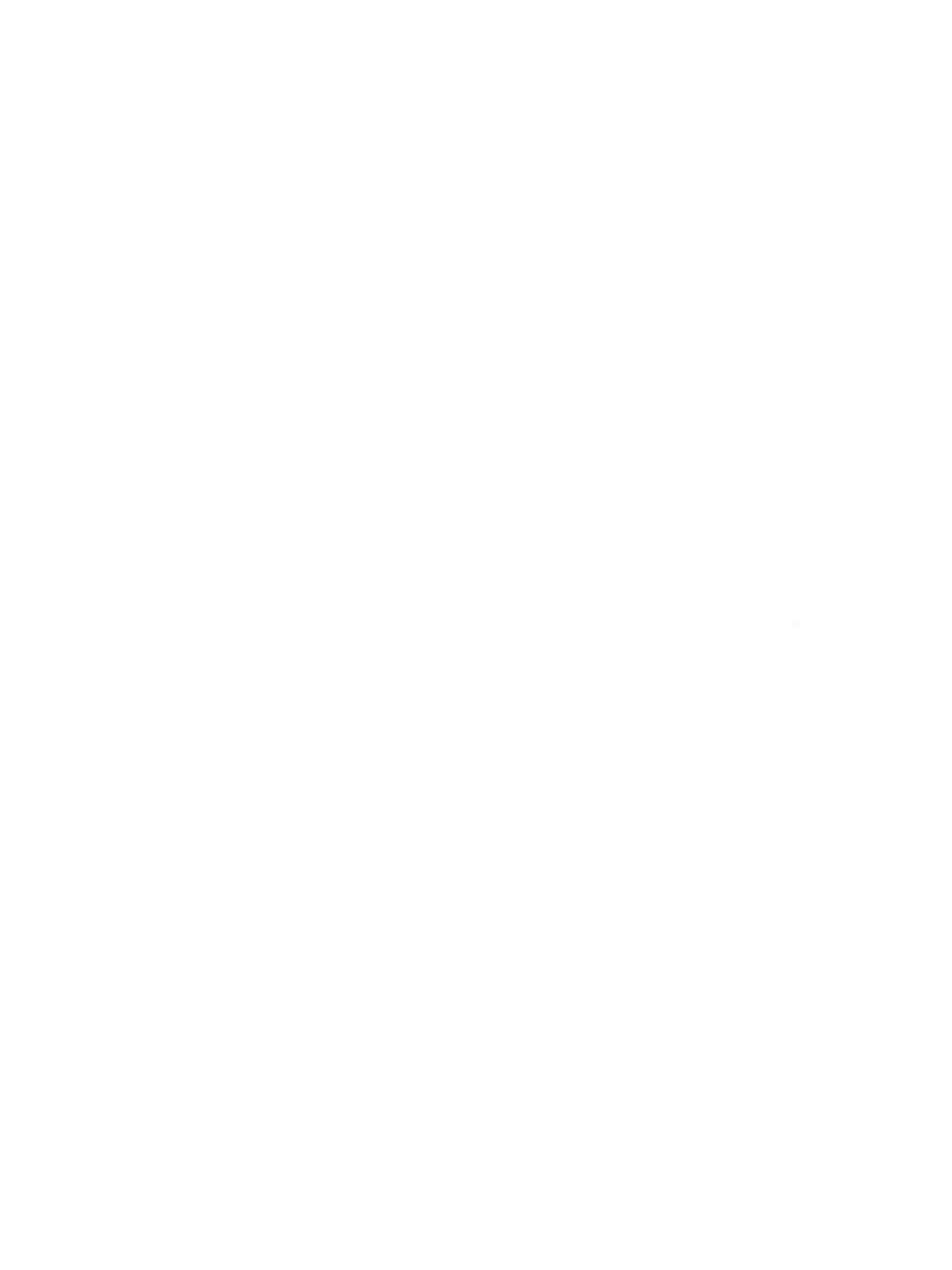 Silhouette of a person holding a suitcase and walking on a platform, with a train in the background.