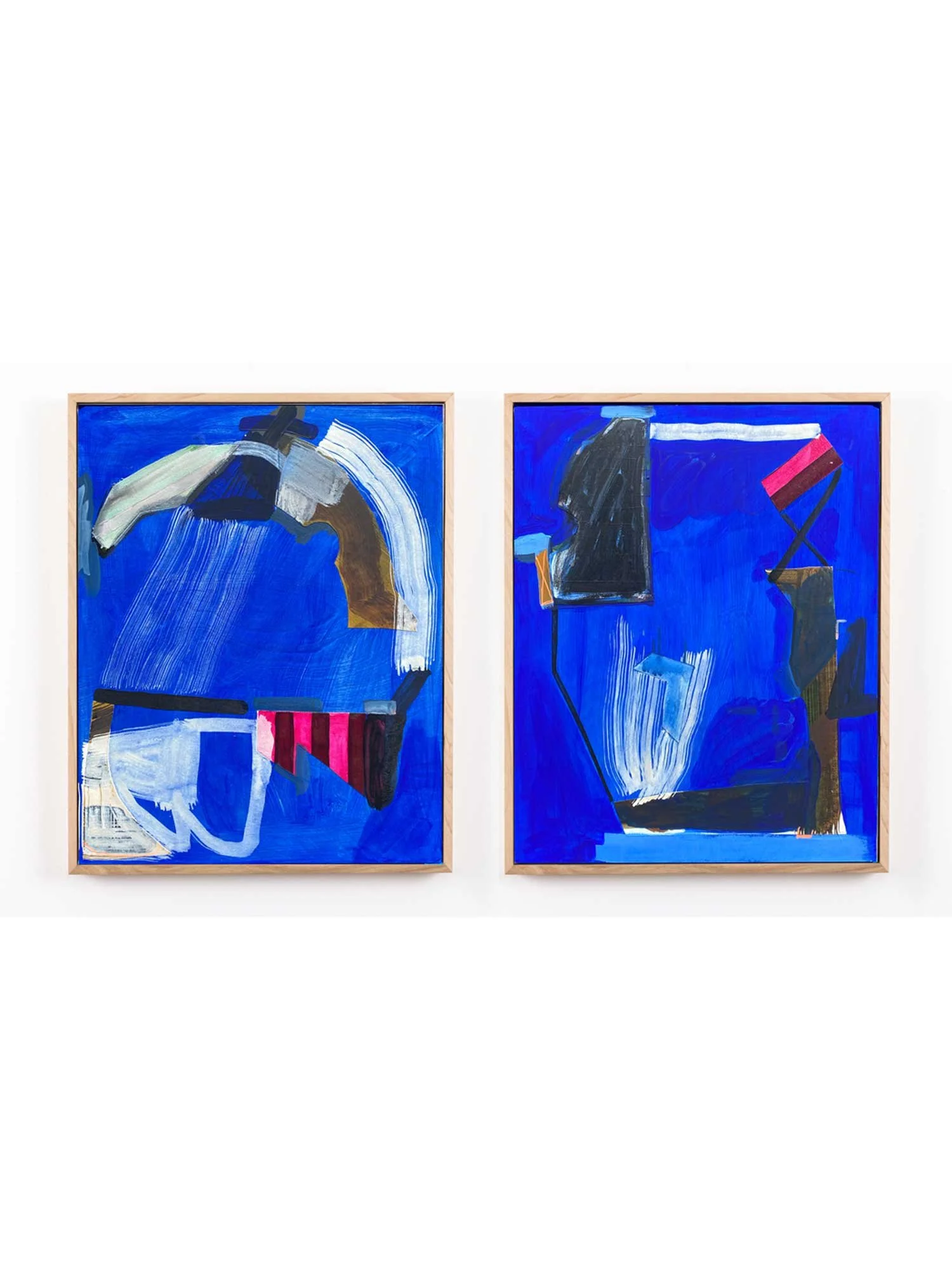 Two abstract paintings with blue backgrounds and various shapes and brushstrokes, framed in light wood.