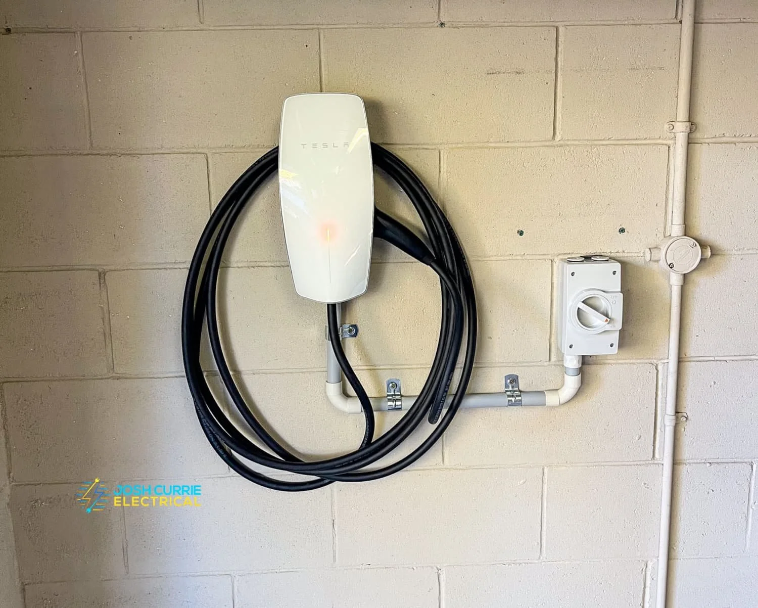 white ev charger installed on garage wall home install Wagga
