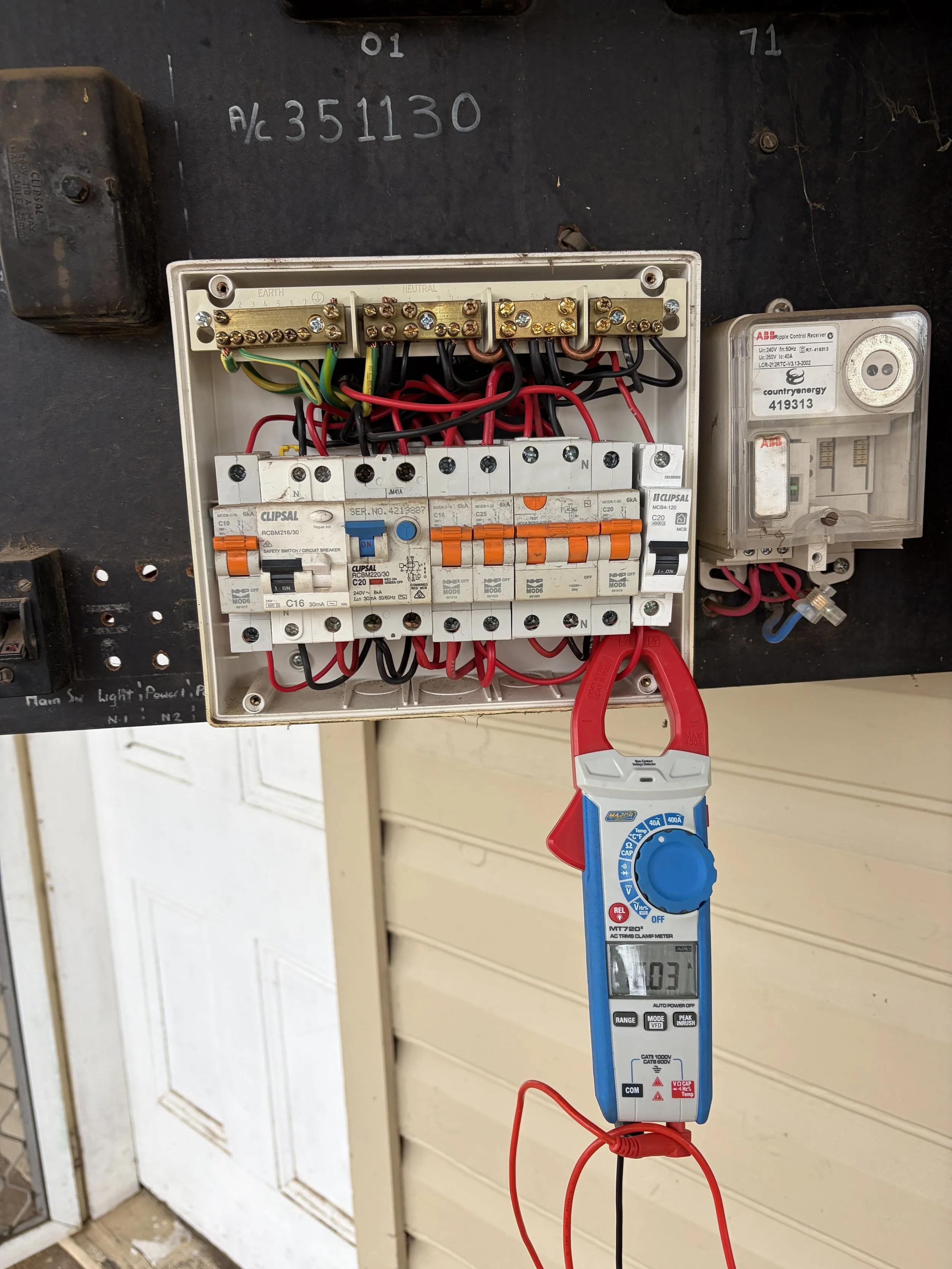 testing switch board, white casing blue and orange wires with fuses