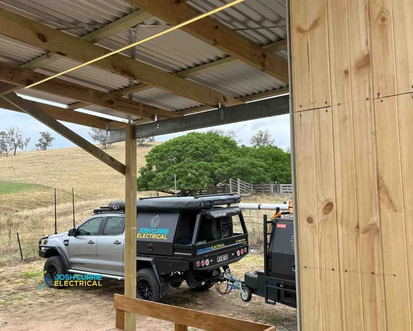Josh Currie electrical on rural property lighting w timber shed and ute parked beside