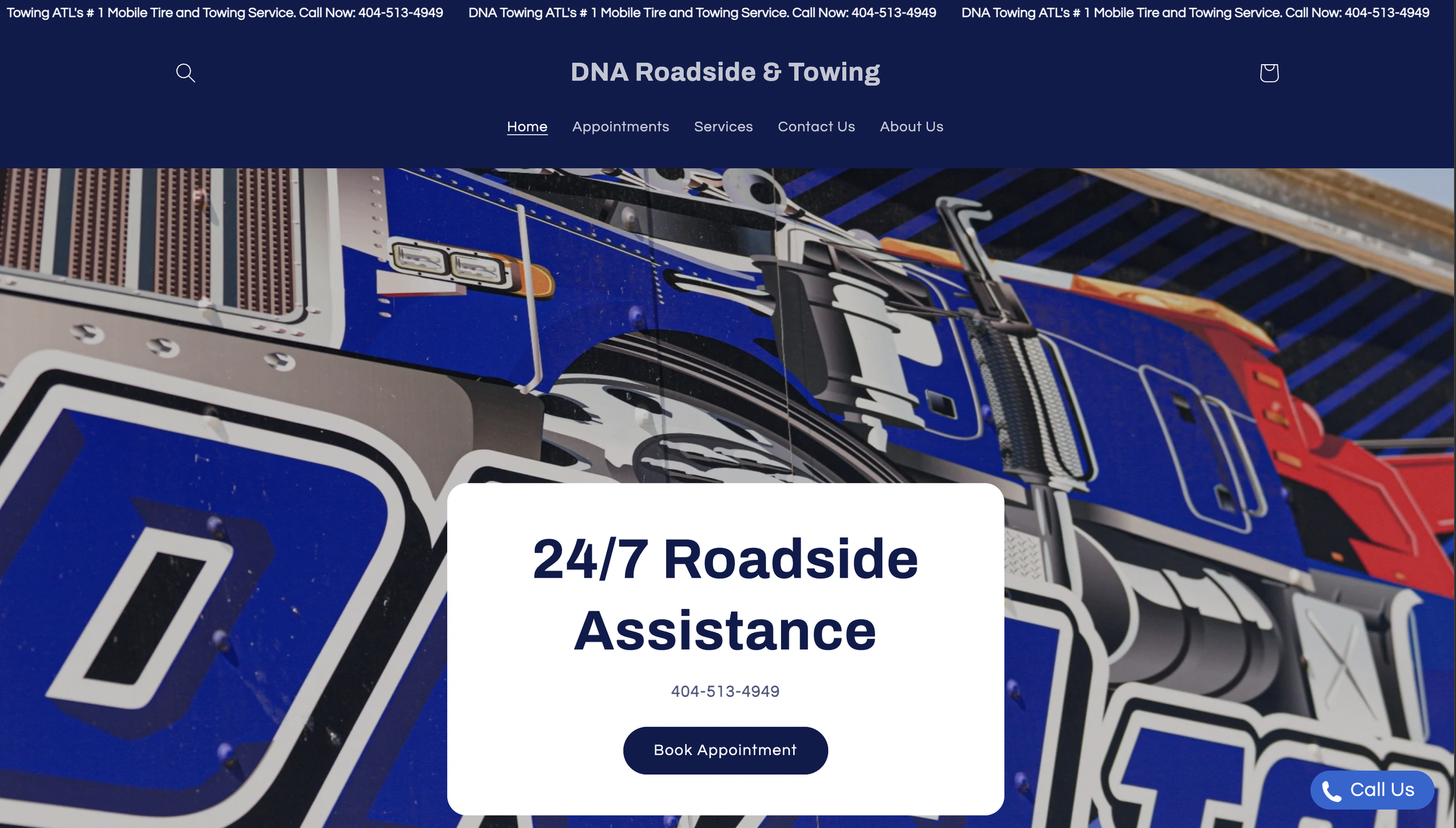 Close-up of a large, colorful sign for DNA Roadside & Towing featuring a graphic of a semi-truck and text offering 24/7 roadside assistance with contact information.