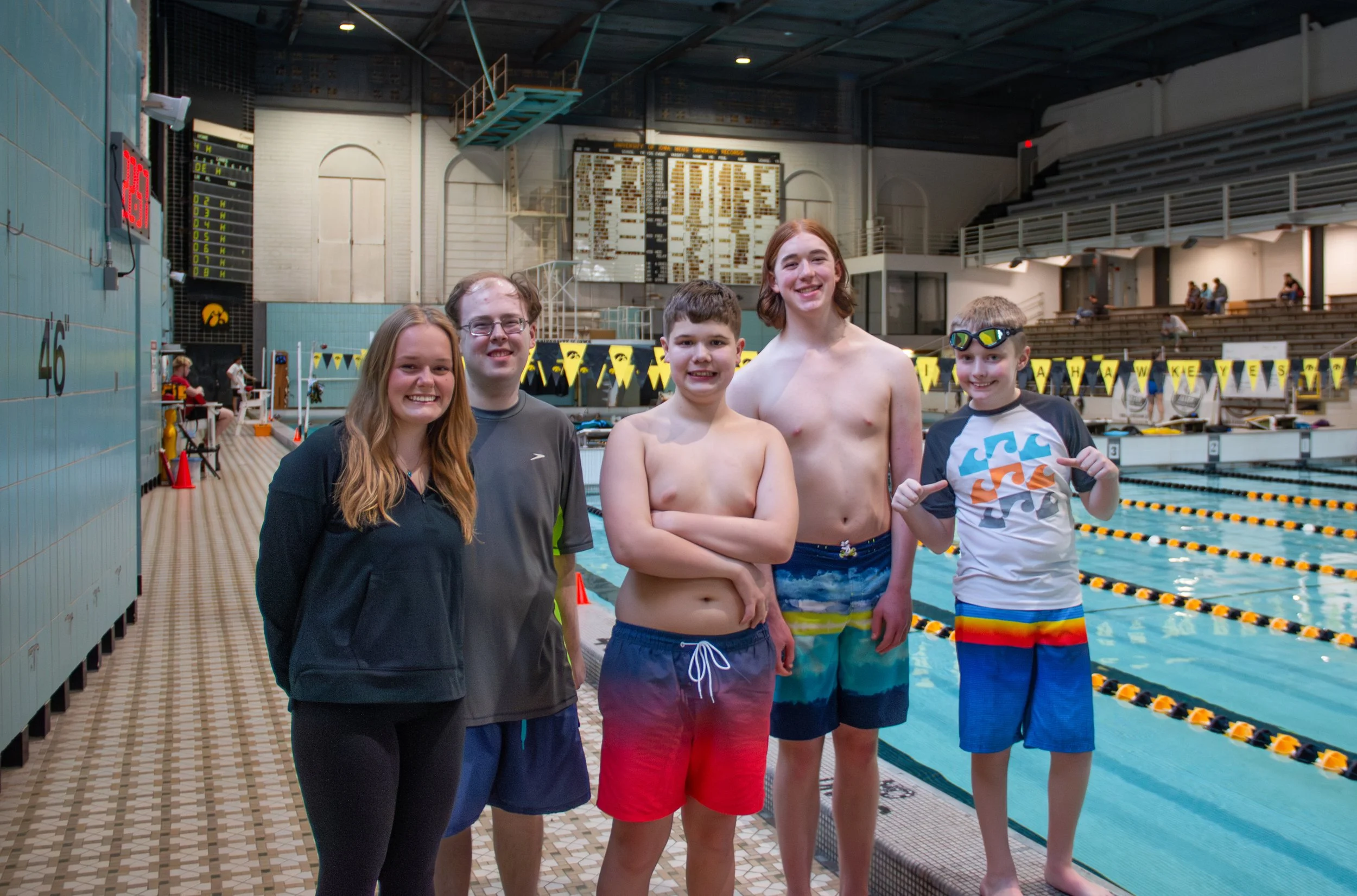 Commonground founder, Megan Mindy, poses with her adaptive swim team at the Universty of Iowa.