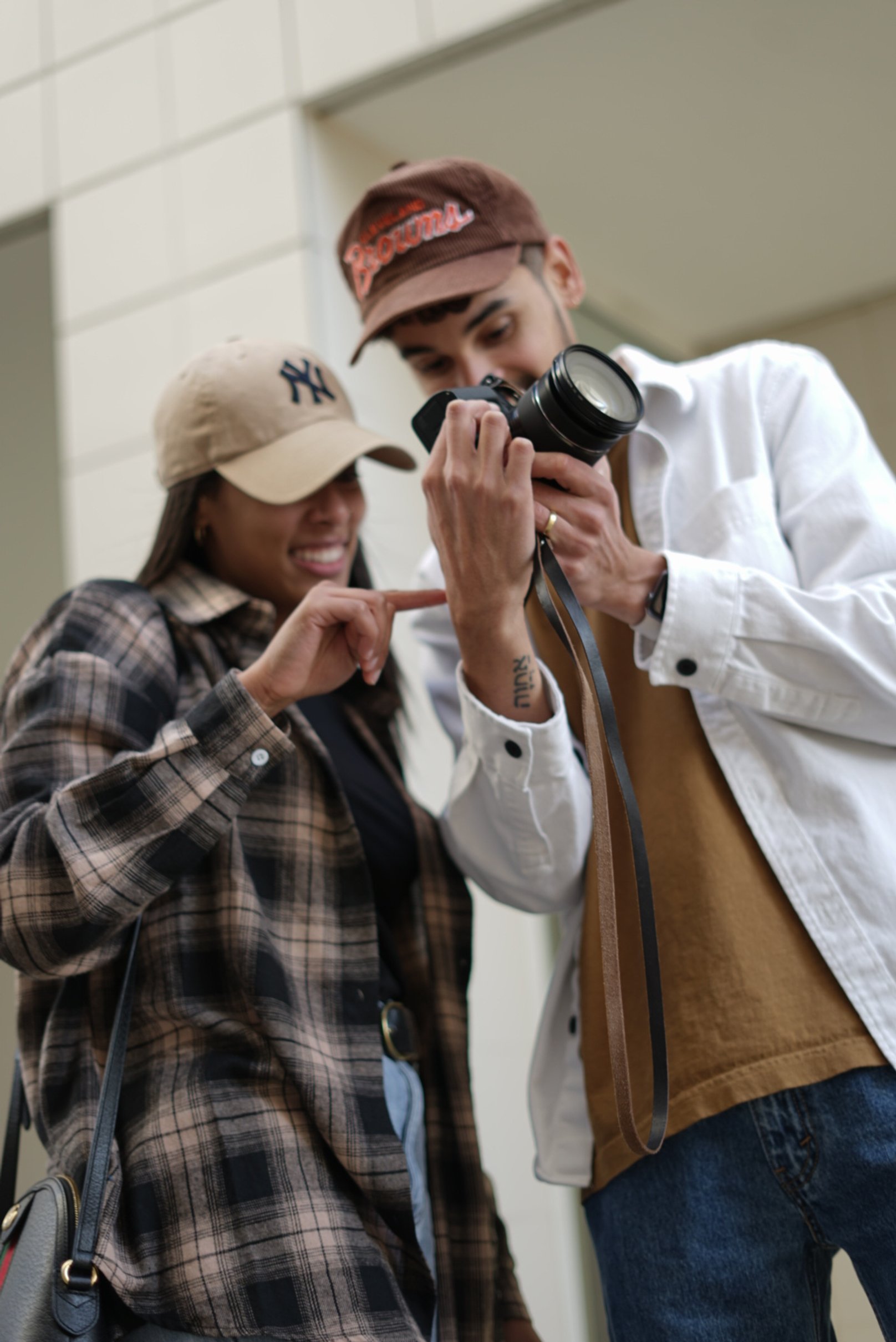 Photo of photographer showing a picture he captured, building his clients personal brand