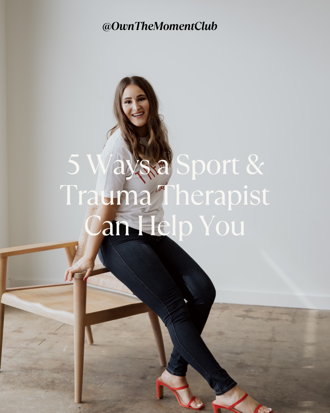 A woman with long brown hair, smiling, sitting on a wooden chair against a plain wall, with text overlay about trauma therapy.