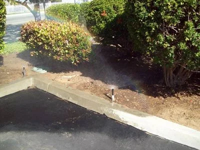 sprinker overspray onto parking lot