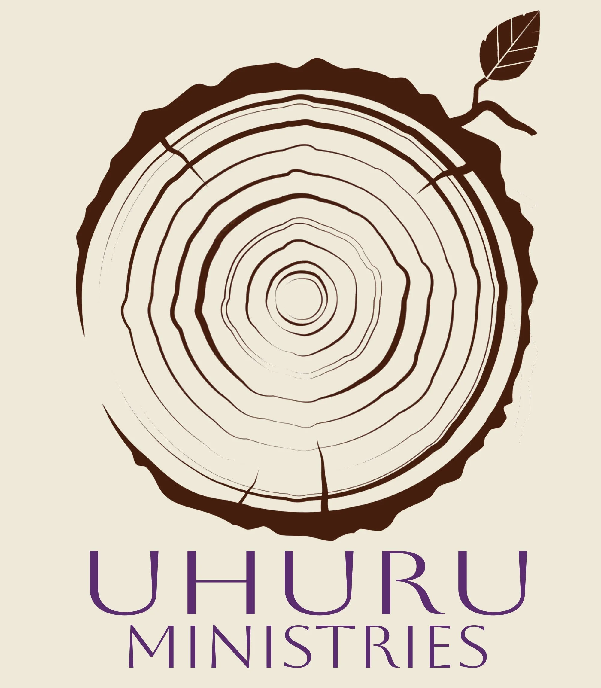 A logo featuring a cross-section of a tree trunk with rings and a small branch with a leaf. Below, the text 'UHURU MINISTRIES' is written in purple.