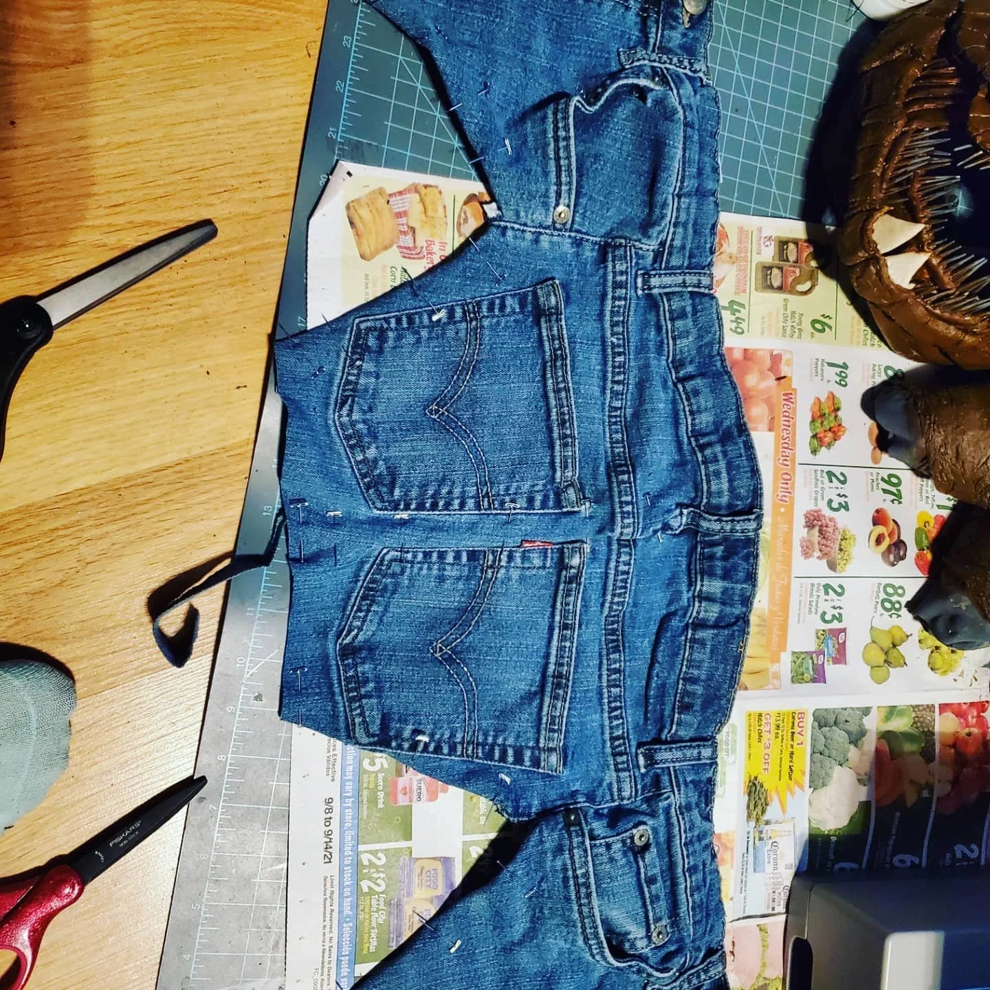 the top of some jeans cut up to resemble a high collar and yoke of a shirt
