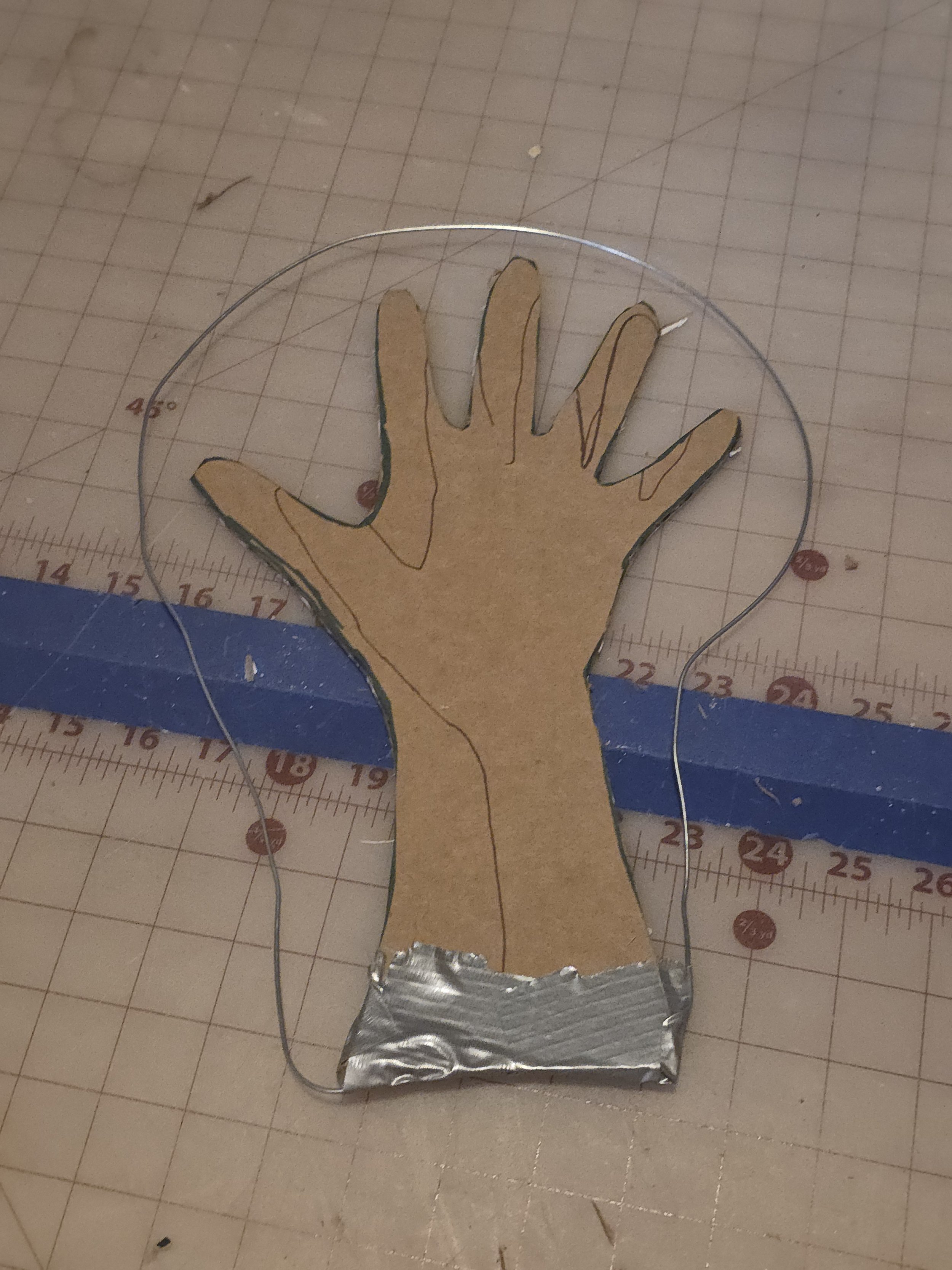 cardboard hand turkey with a wire around it in a big hoop