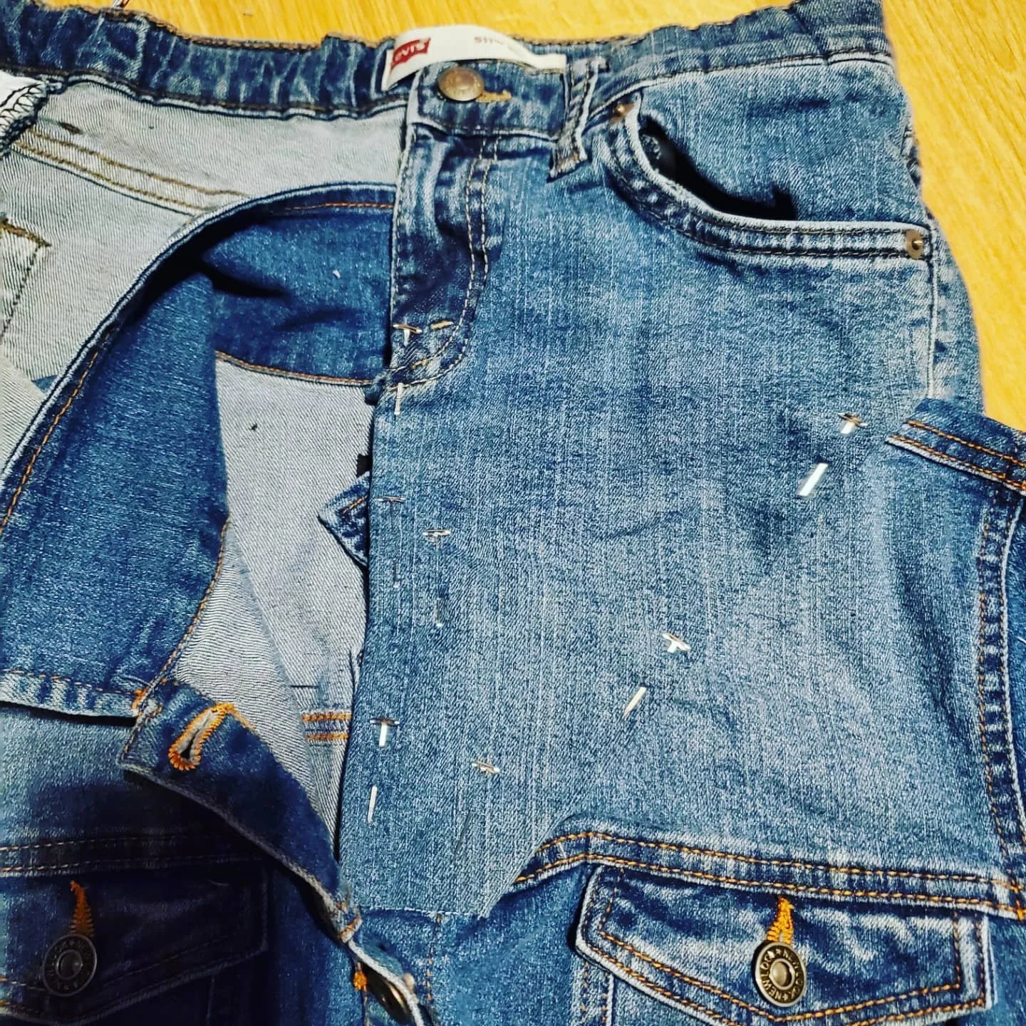 closeup of how a collar sewn onto a denim shirt