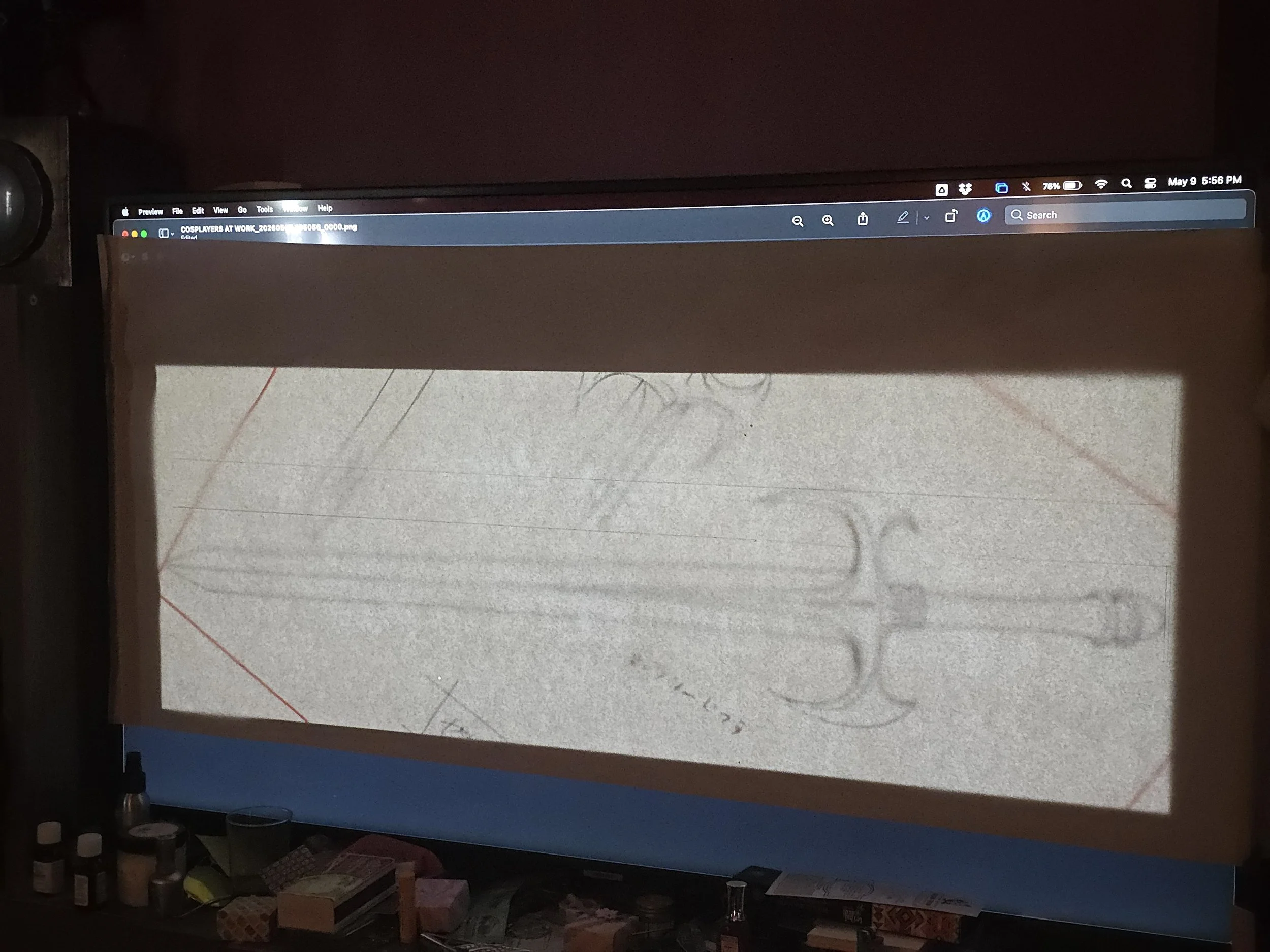 large paper taped onto a tv, with a full-sized sword traced from an image underneath. The image is a drawing from the Slayers concept art