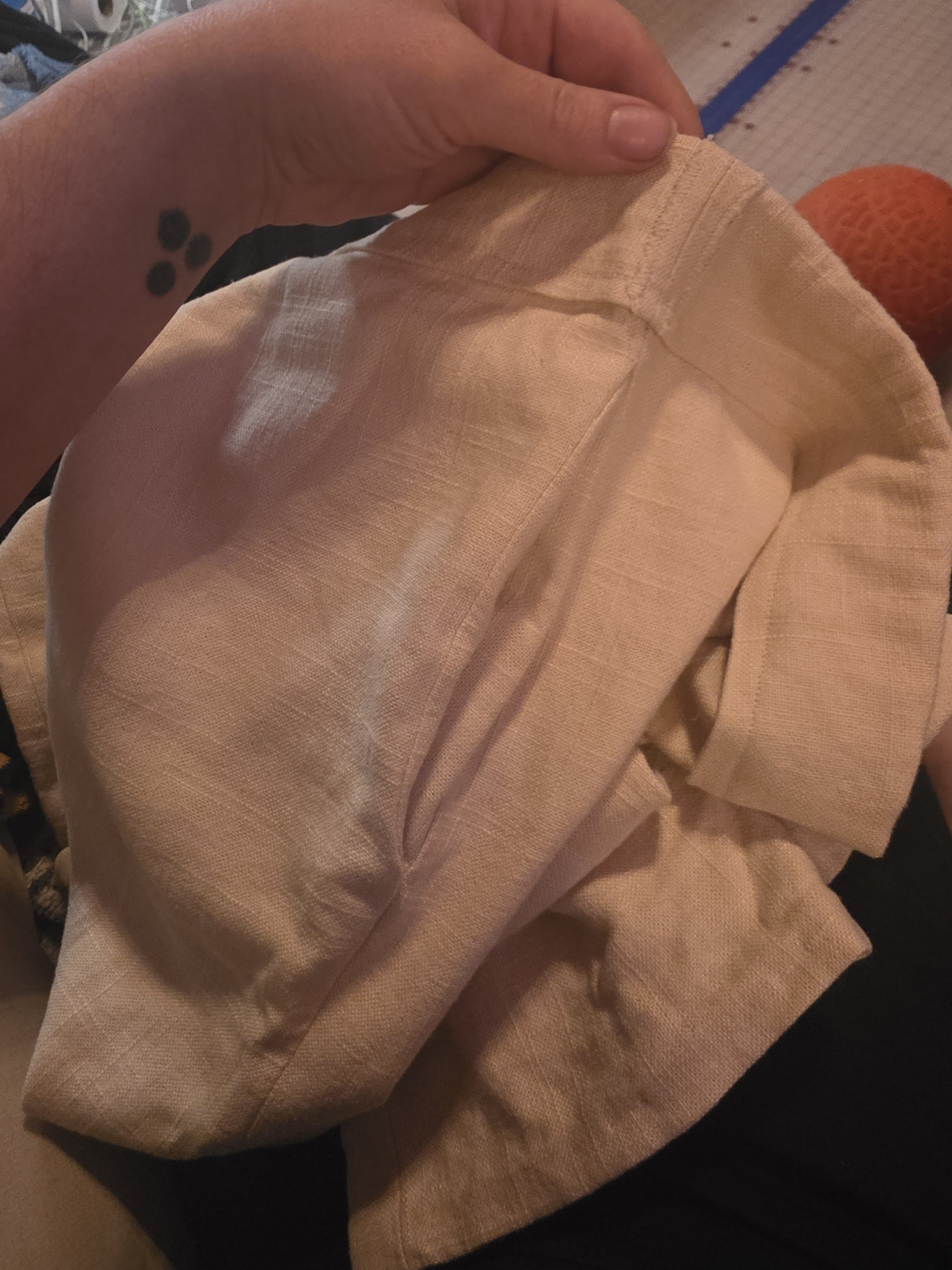pocket in the side of off-white linen pants