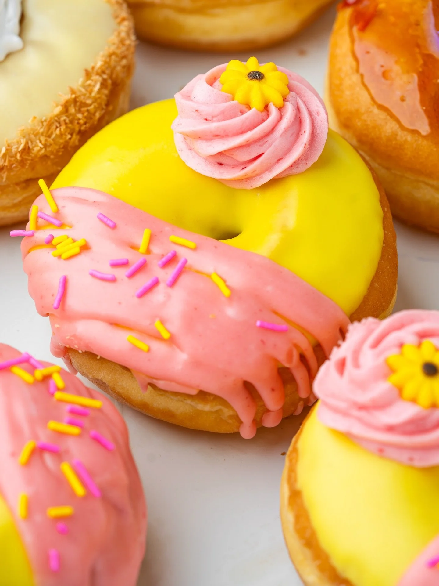 Freshly-squeezed summer vibes. ⛱️ Our Pink Lemonade seasonal flavour is a strawberry &amp; lemon glaze topped with strawberry buttercream 🍓🍋🍩. Zesty, fresh, delicious.