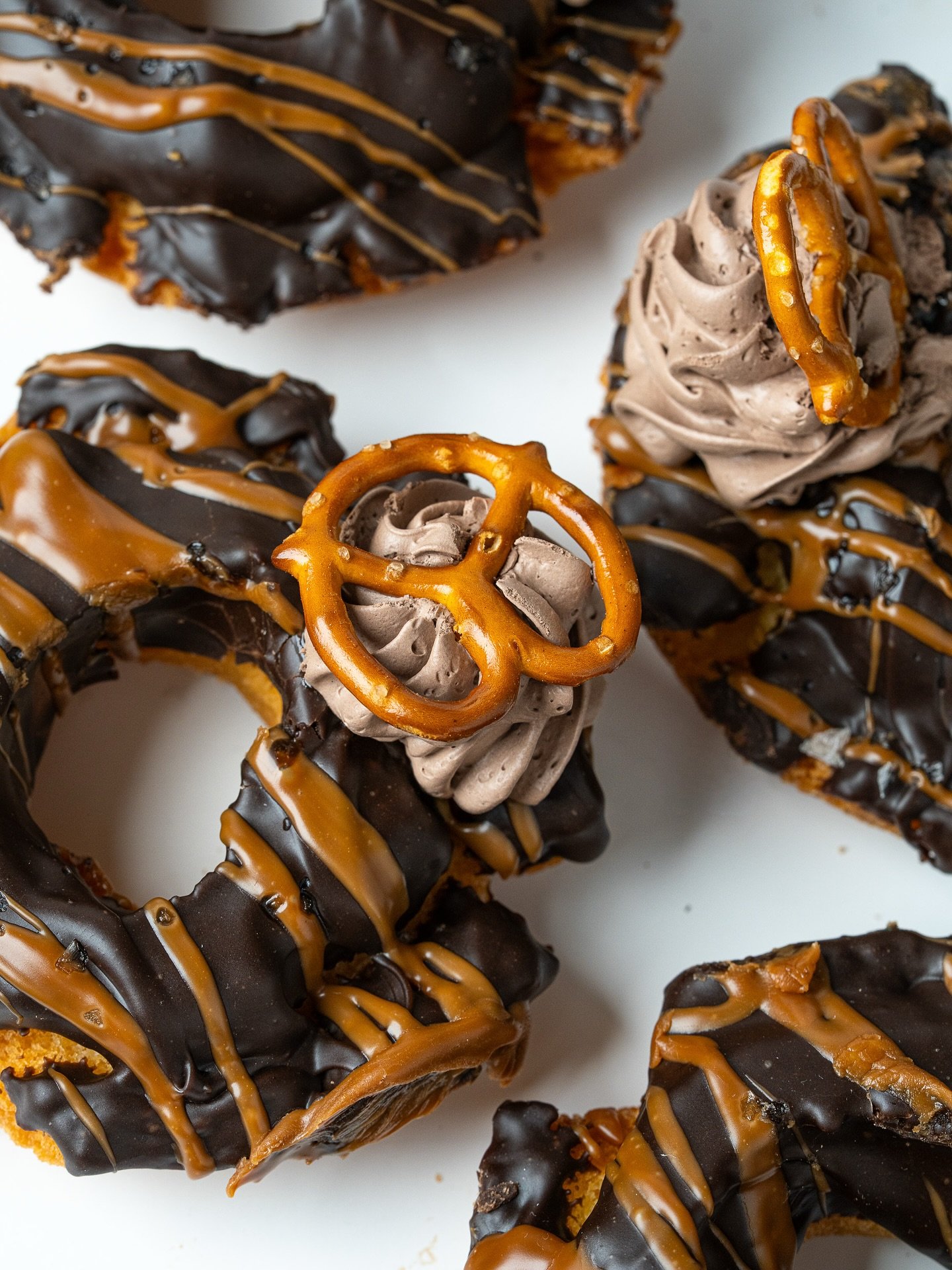 The Chocolate Pretzel 🍫🥨. New on our Seasonal menu, it's an Old Fashioned donut dipped in chocolate&nbsp;glaze and drizzled with warm caramel fudge. Finished with a sprinkling of Maldon sea salt and a pretzel 👌🏽.