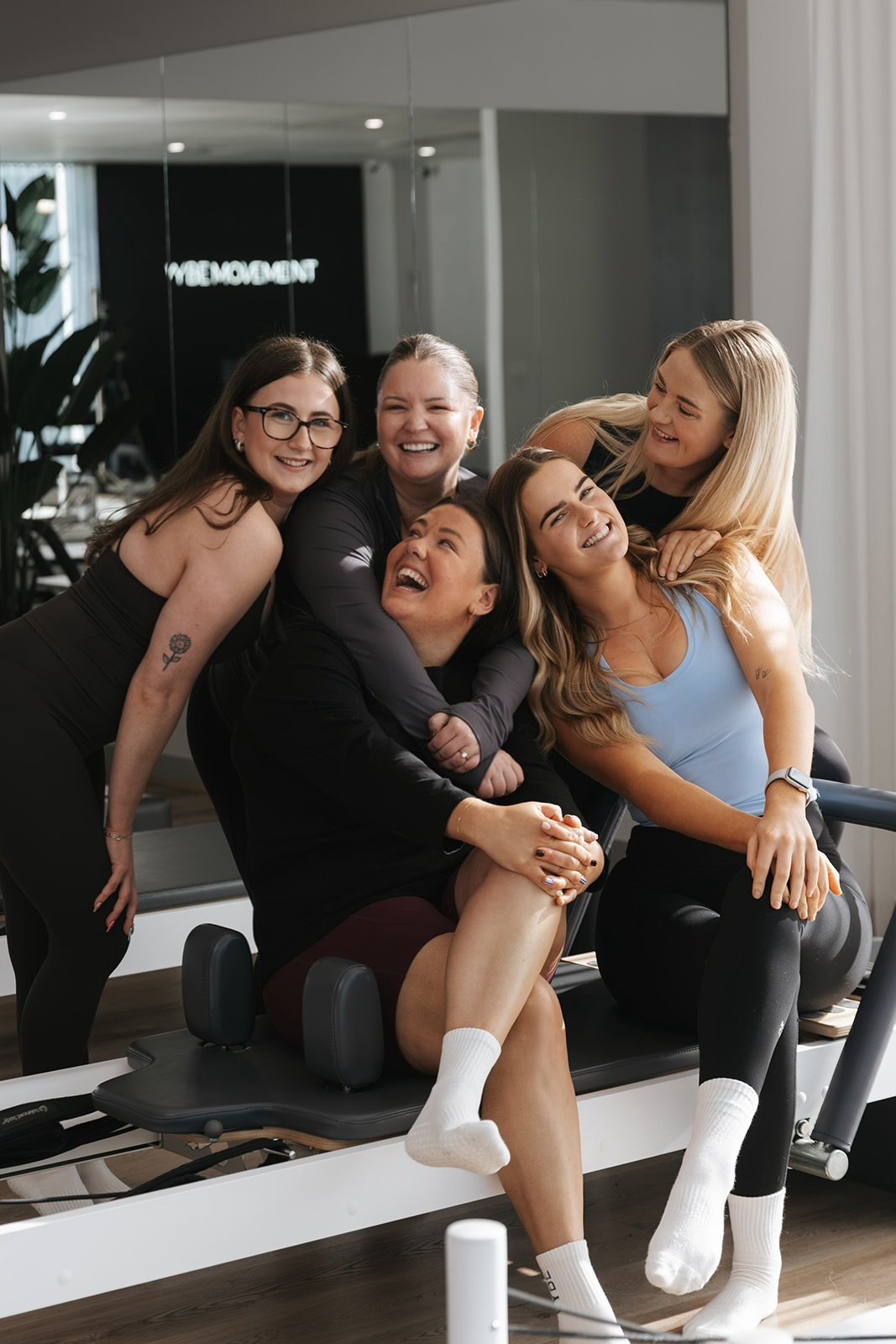 The Vybe Movement team sharing a moment together at their Cranbourne studio.