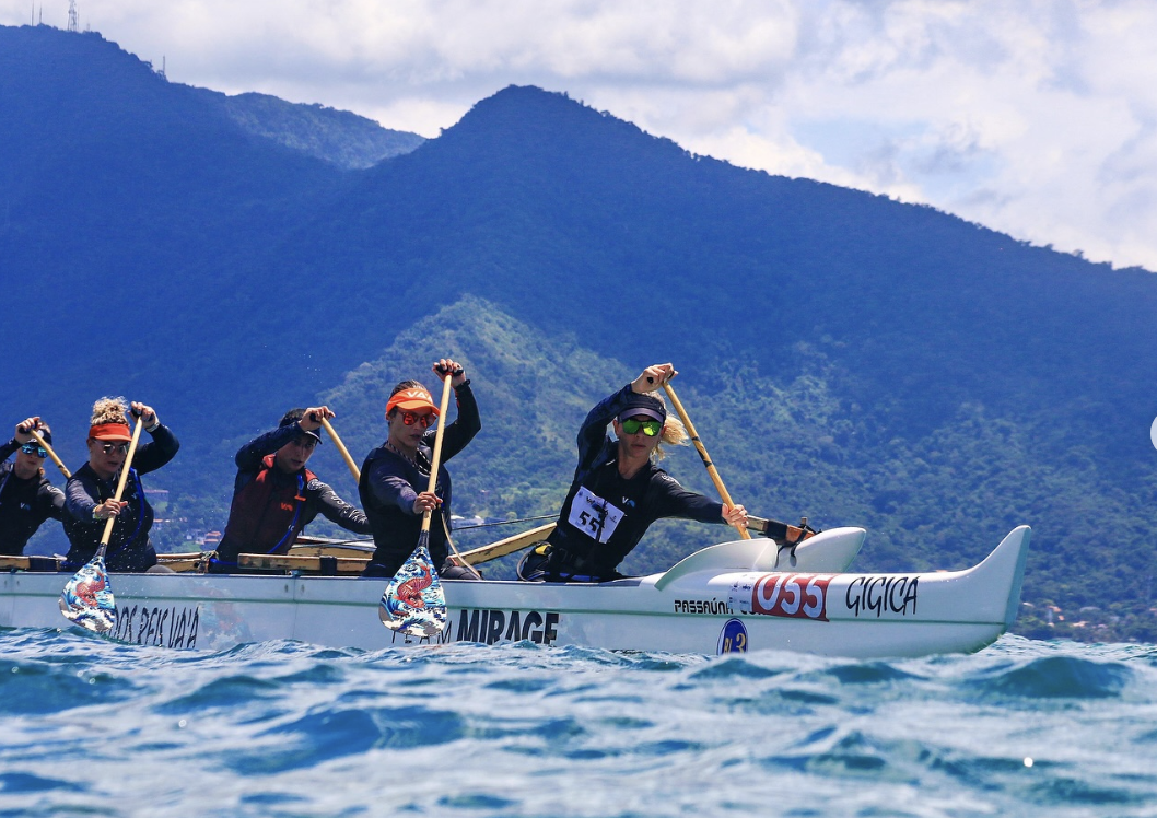 Athletes paddling in a canoe race showcasing competitive sports performance