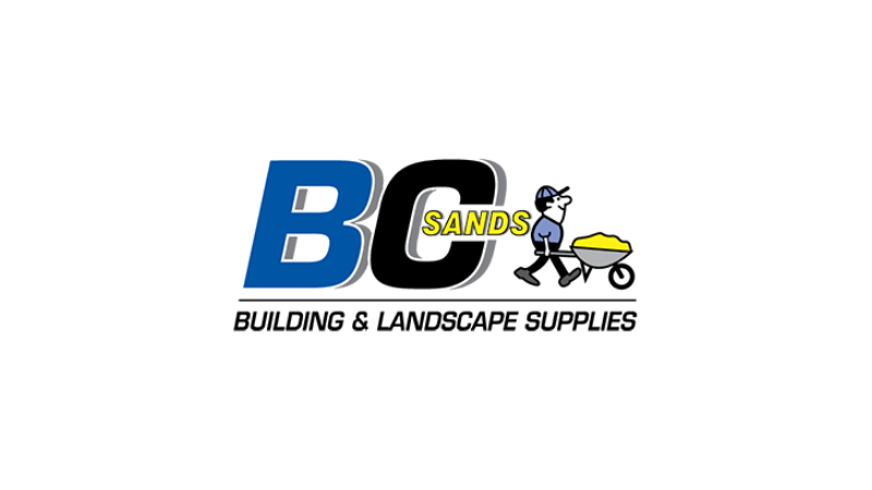 Logo with large blue and gray letters BC, a small cartoon seagull wearing sunglasses holding an umbrella, sitting on a yellow scoop of sand, with the word SANDS written across the sand.