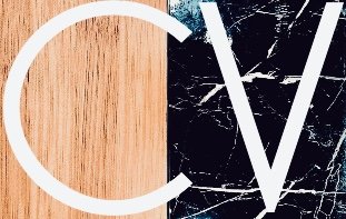 Close-up of a modern graphic logo with a wooden background on the left and a black marble background on the right, featuring white stylized letters 'C' and 'V'.