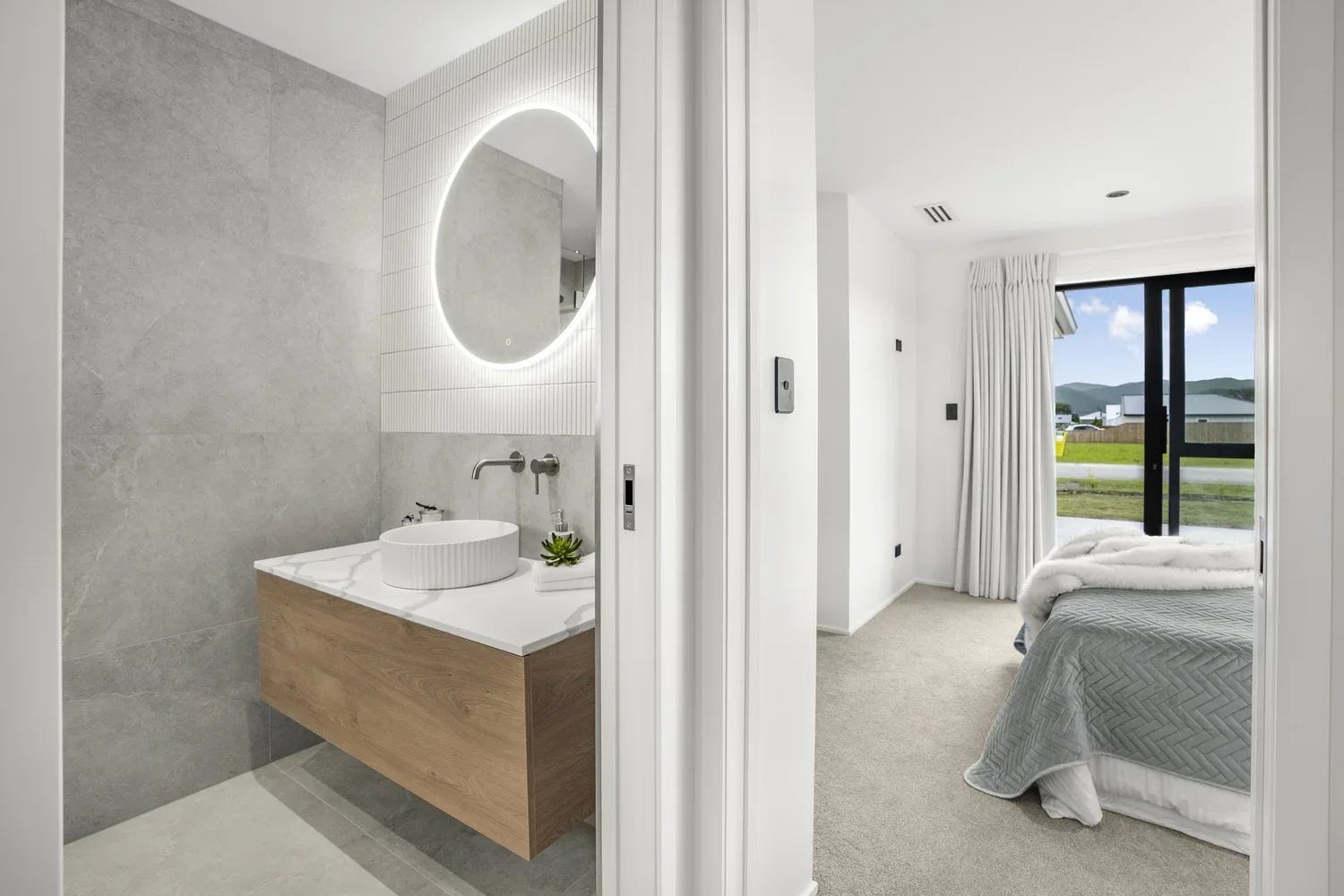 New bathroom, fully renovated with tiled floor and walls, glass shower, granite vanity top and large LED mirror