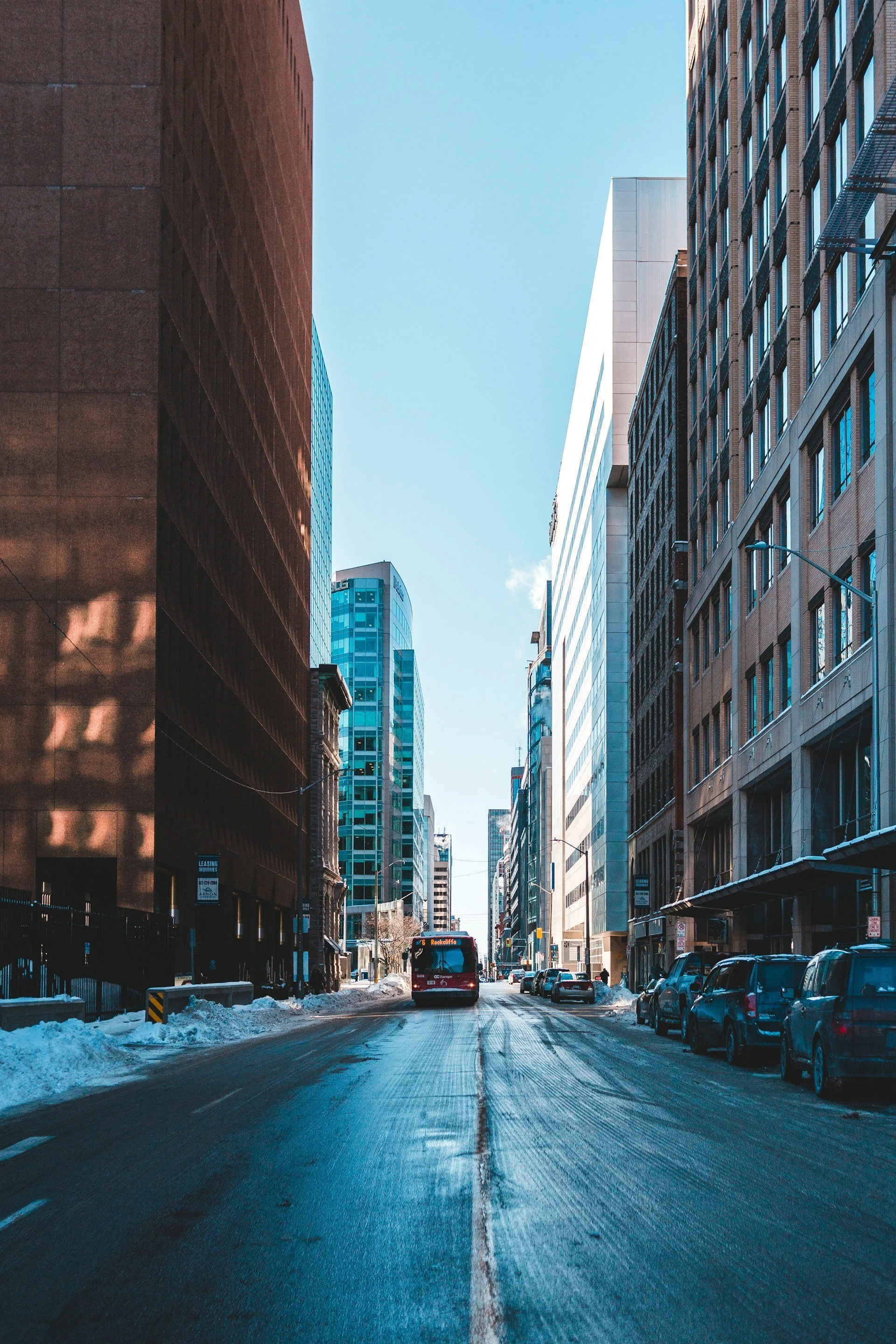 Winter in Toronto with red bus – immigration law firm supporting newcomers through every season