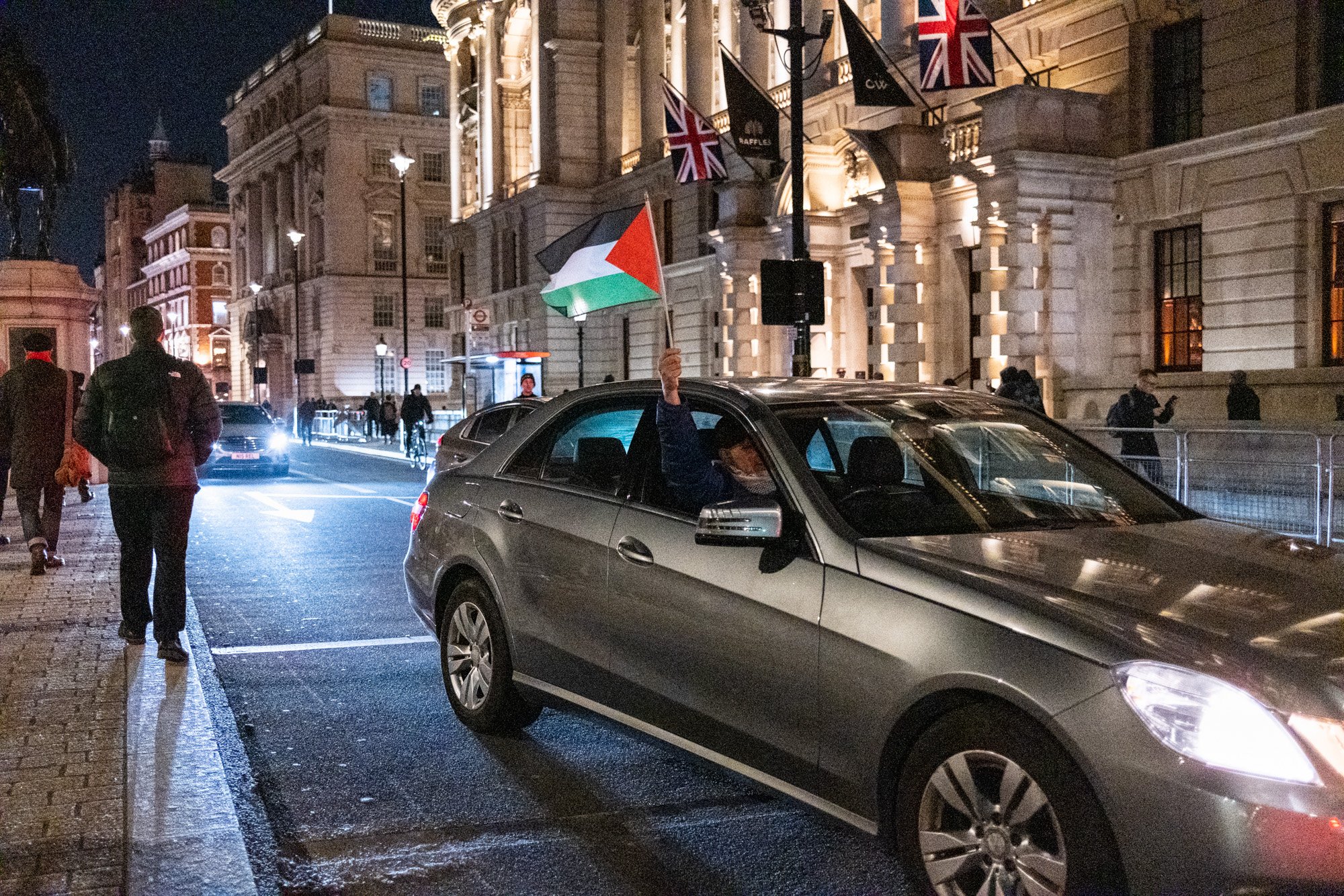 A driver shows his support of the pro-Palestine march whilst driving past the demonstration in central London - November 15, 2023