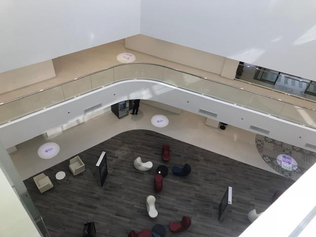 Interior view of projected navigation signs in a modern hospital building in Jeddah.