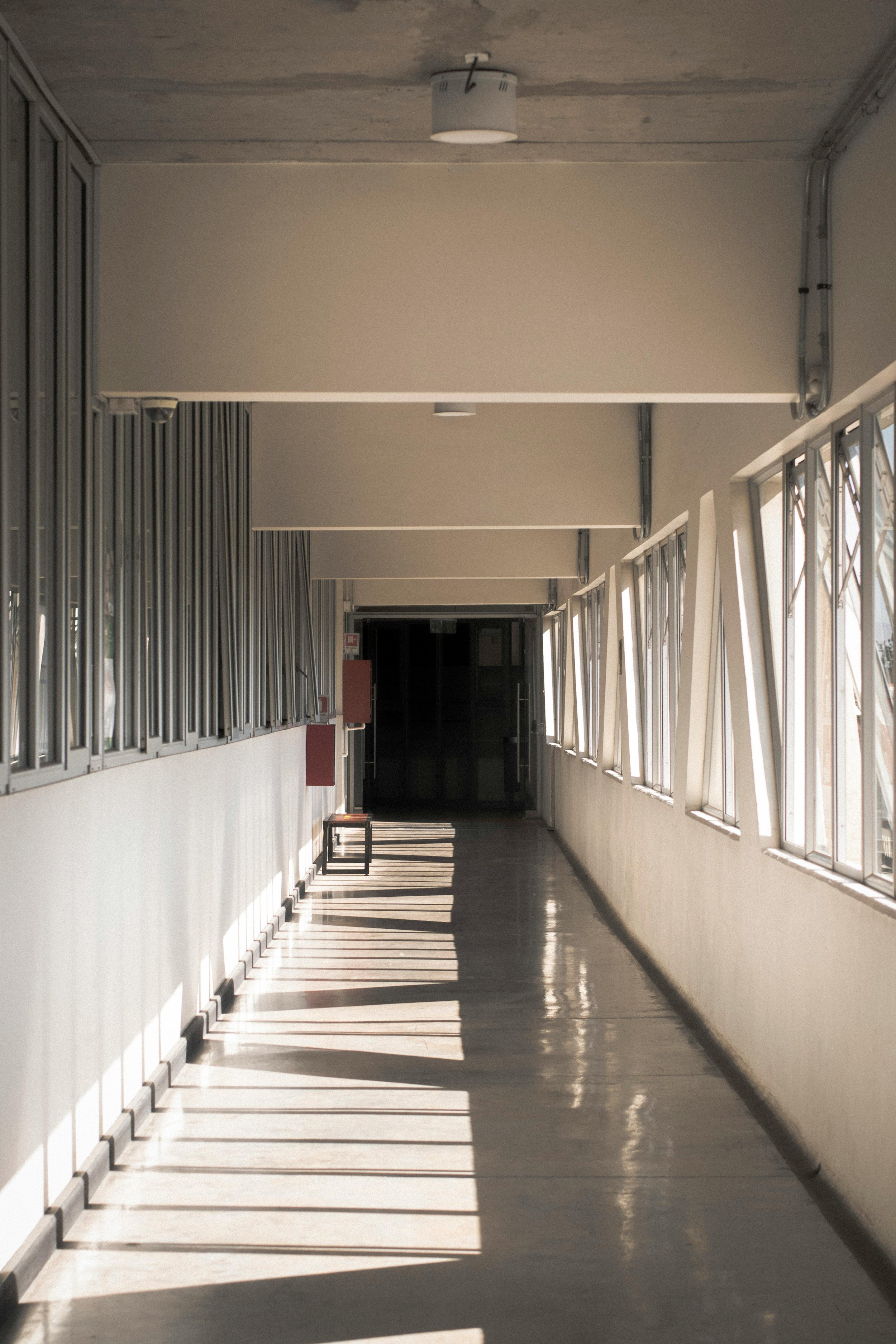 image of a long hospital hallway to represent the experience of individuals who may look for therapy to heal from medical trauma or PTSD..