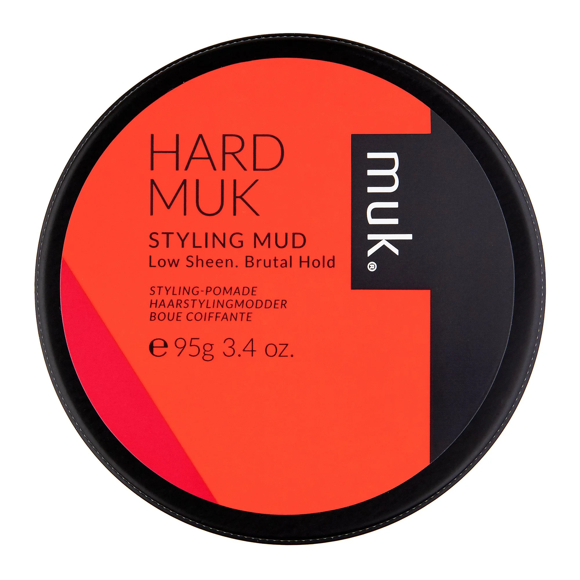 A round container of MUK Hard Muk Styling Mud with a black lid and red label, describing low sheen and brutal hold.