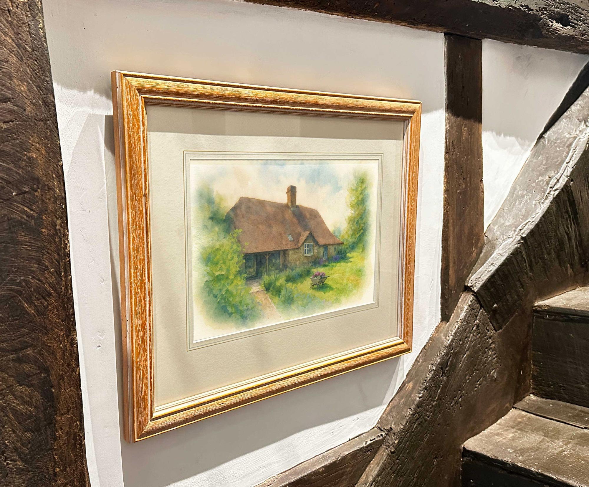 Framed architectural sketch (print) in timber-framed interior showing a traditional brick house. SOANE style presentation emphasizing character and context.
