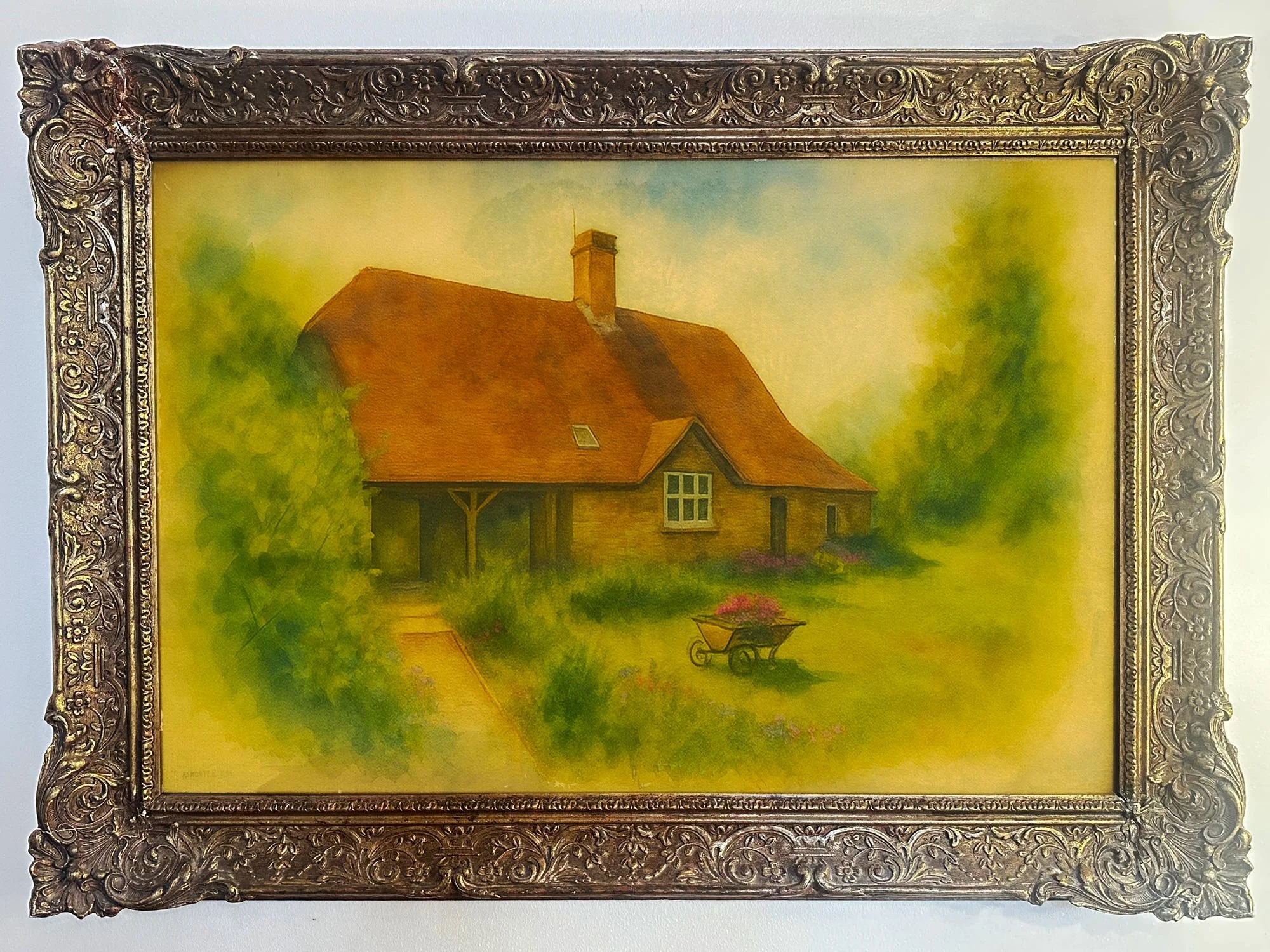 A painting of a house with a red roof, surrounded by greenery and flowers, with a wheelbarrow filled with pink flowers in the front yard.