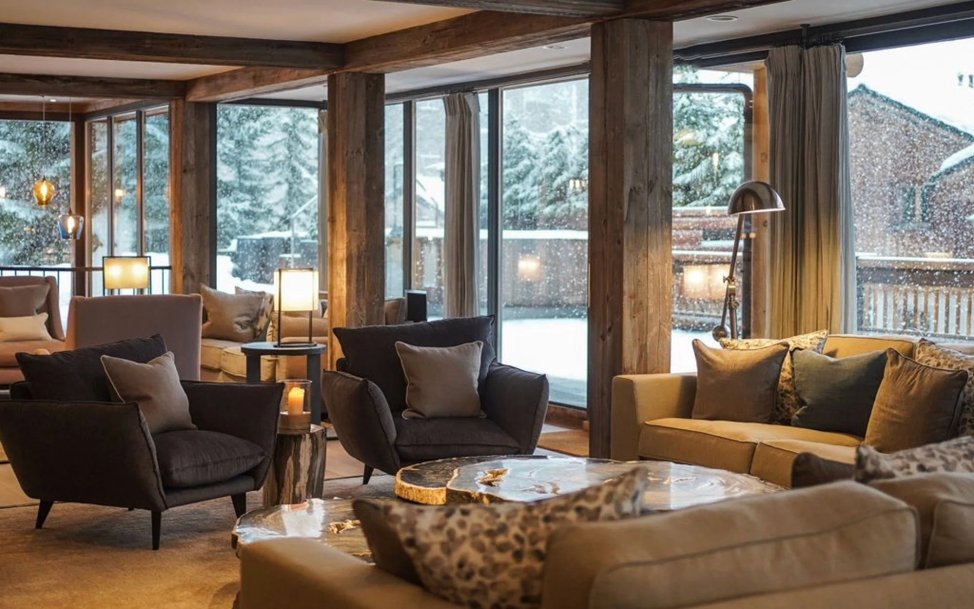 Luxury interior of ski chalet with snow outside