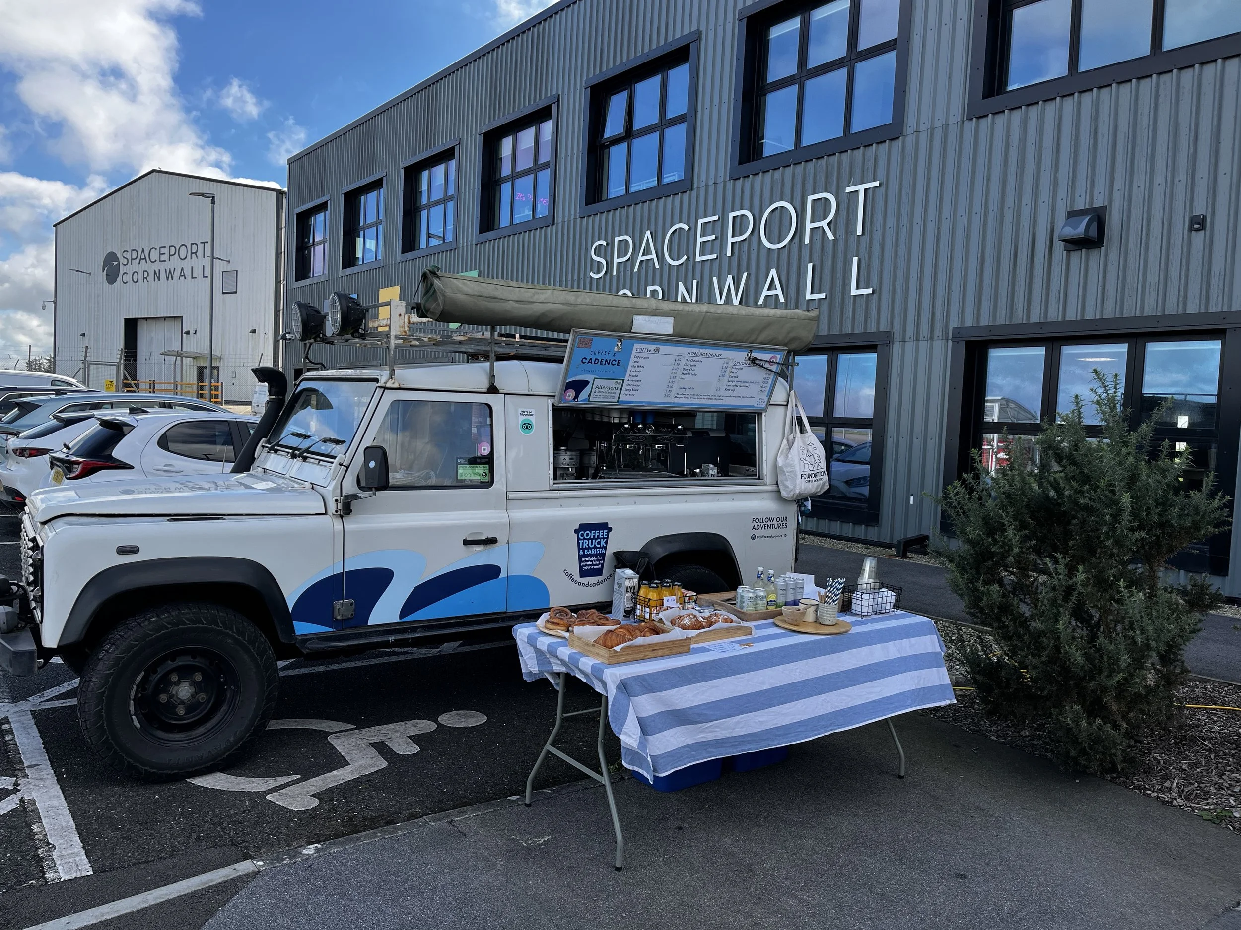 Coffee & Cadence vintage Land Rover defender coffee truck parked at Spaceport Cornwall for a defence sector corporate networking event.
