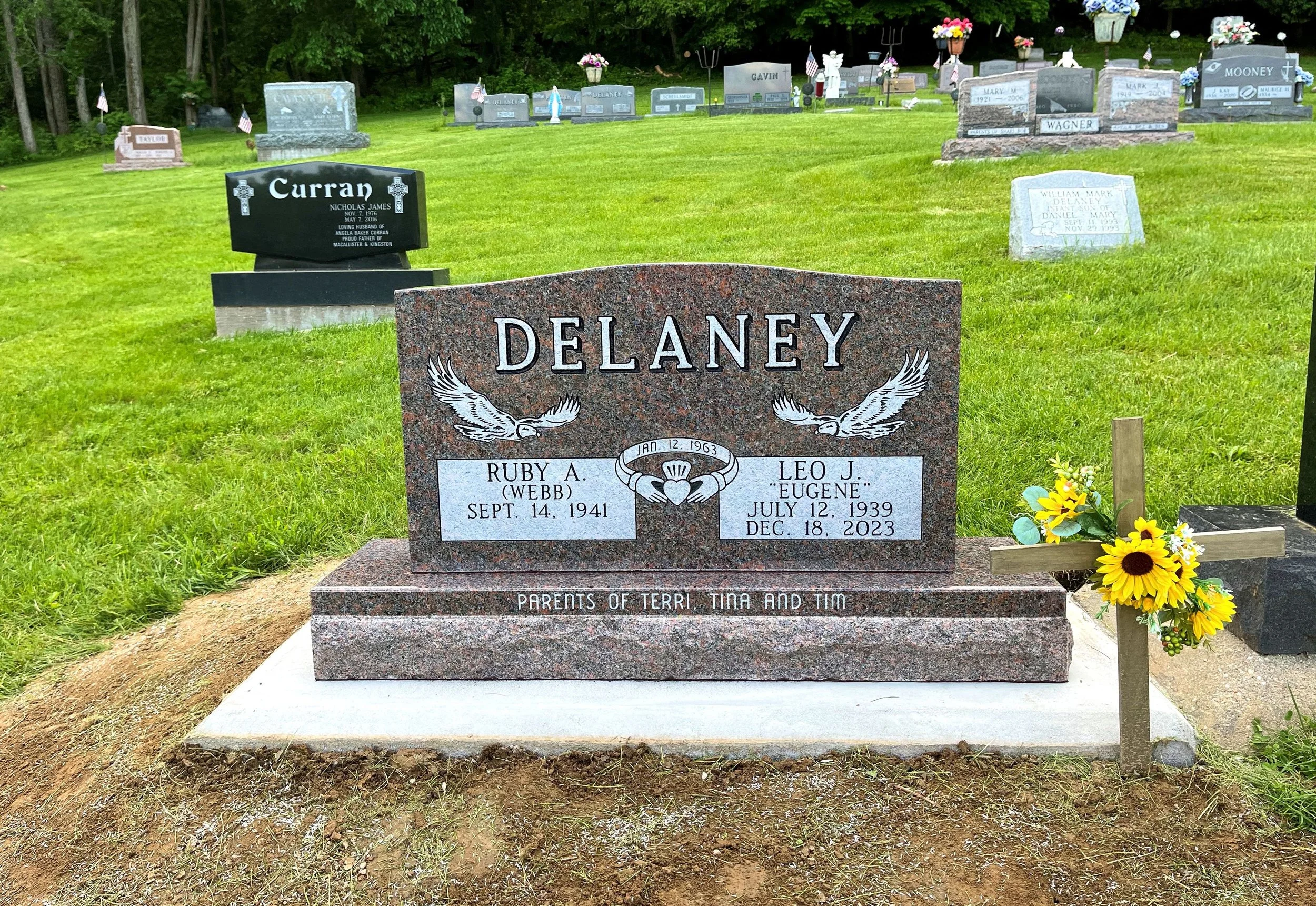 Mahogany Headstone for Husband and Wife. Featuring Two Eagles and Wedding Design. Children's names are engraved on the Polish Margin Base.