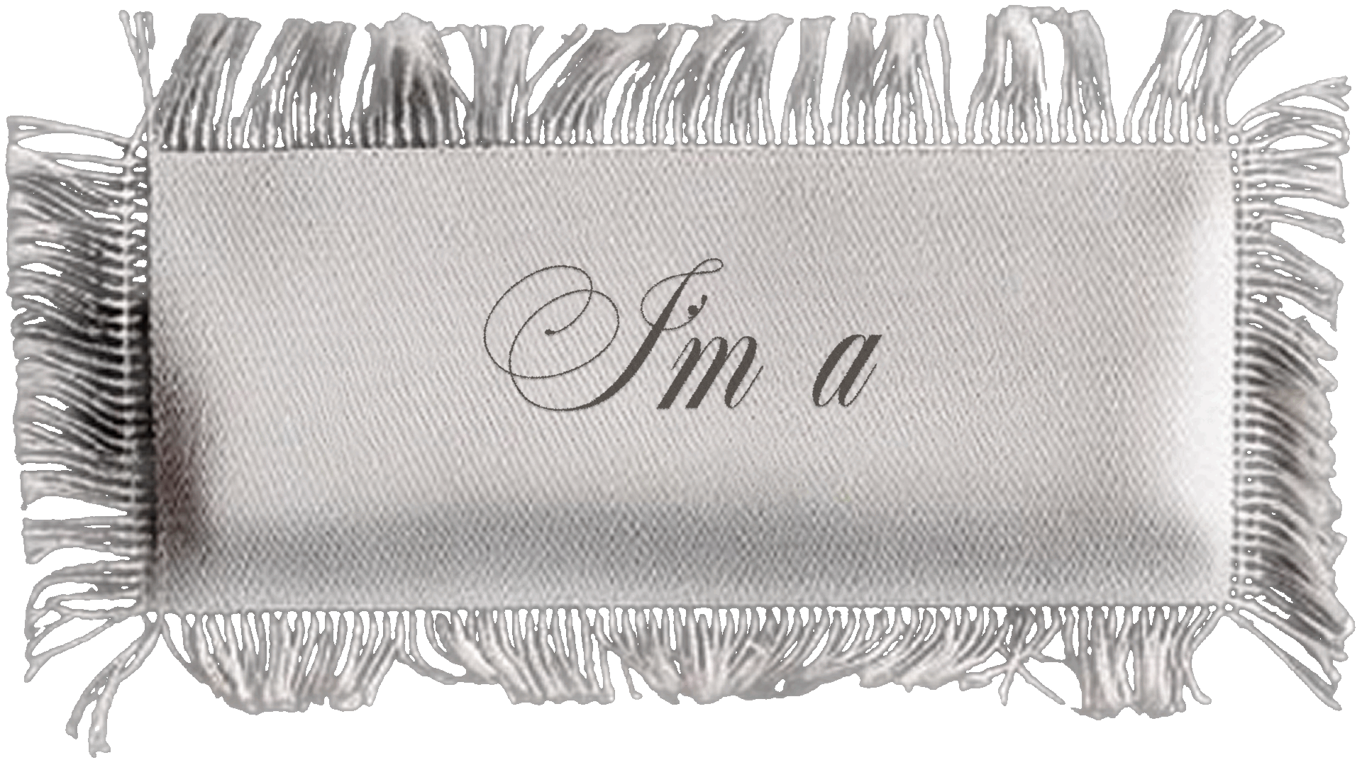 A decorative white fabric with fringe border featuring the words 'I'm a' in elegant cursive writing.