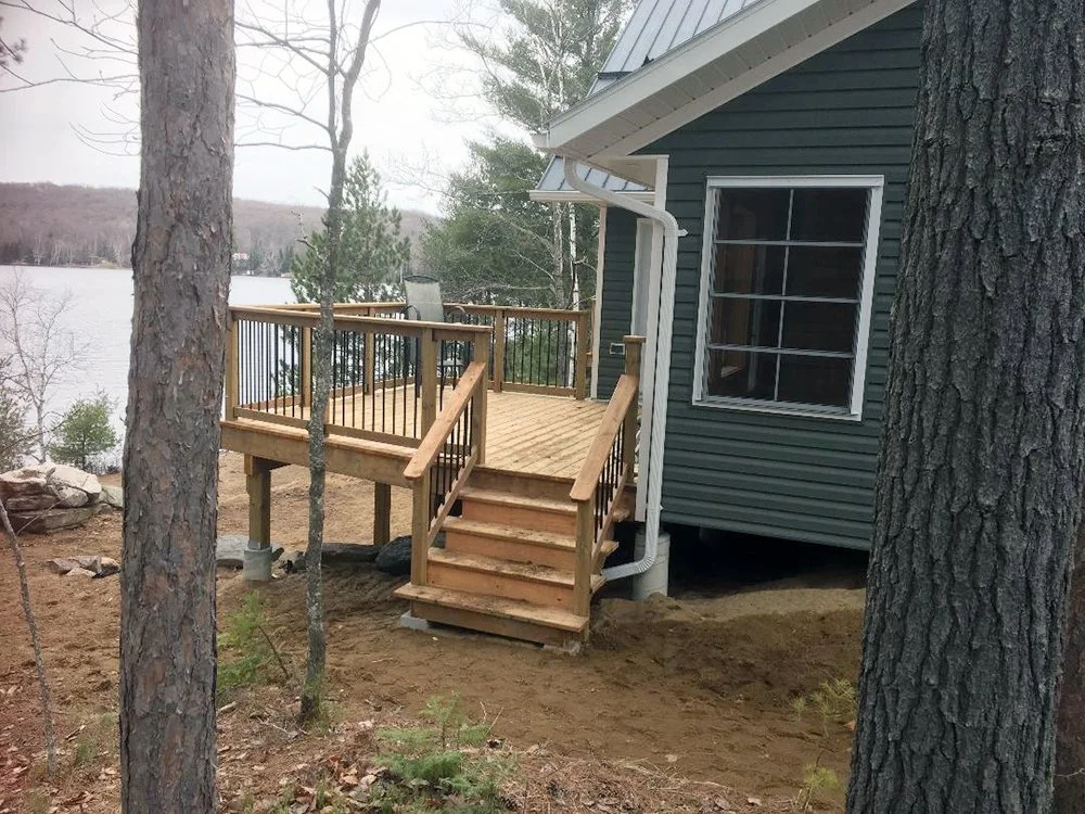 innovative-construction-custom-cottage1-side-wooden-deck.jpg