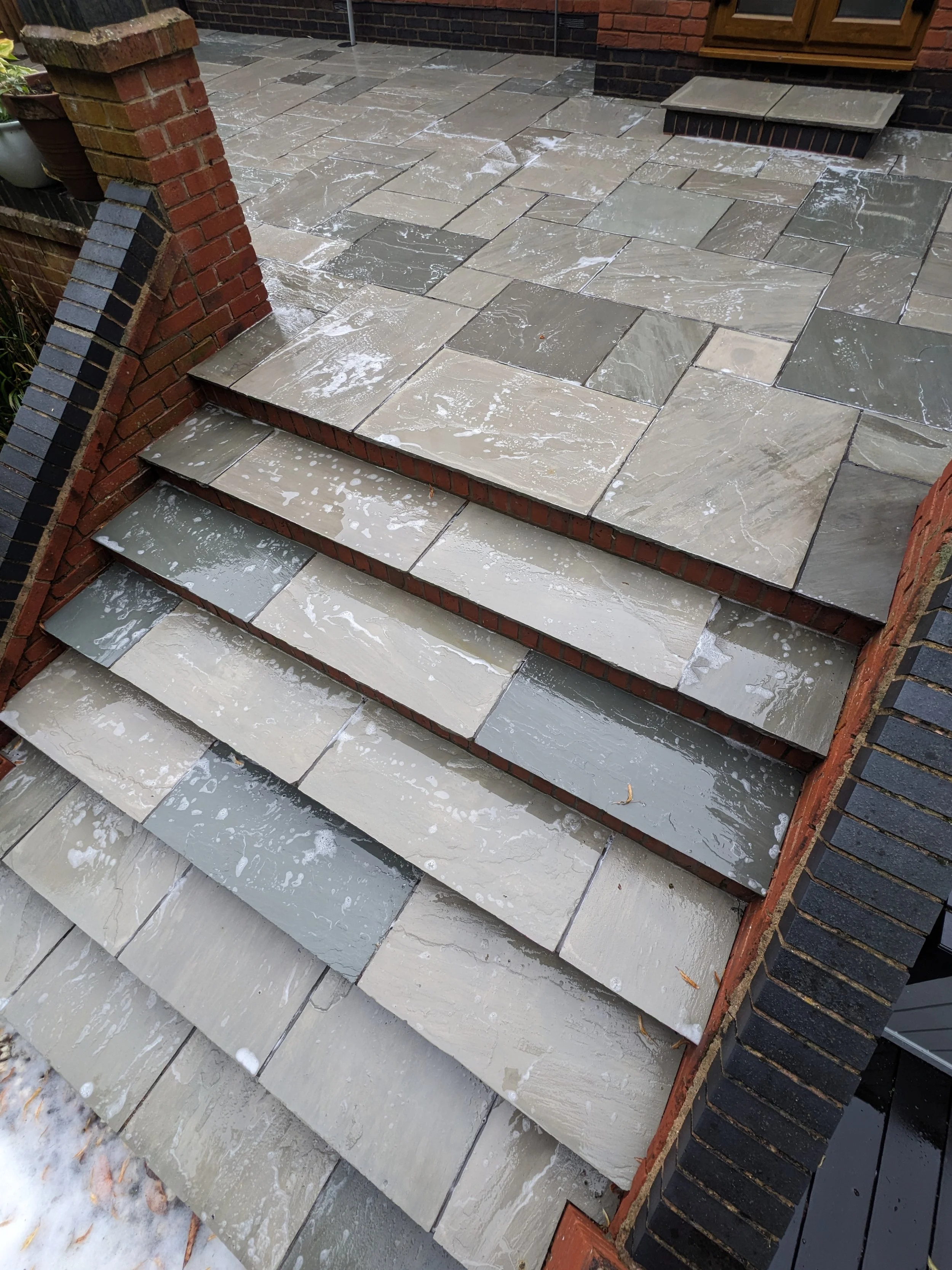 Patio slabs cleaned using pressure washing equipment