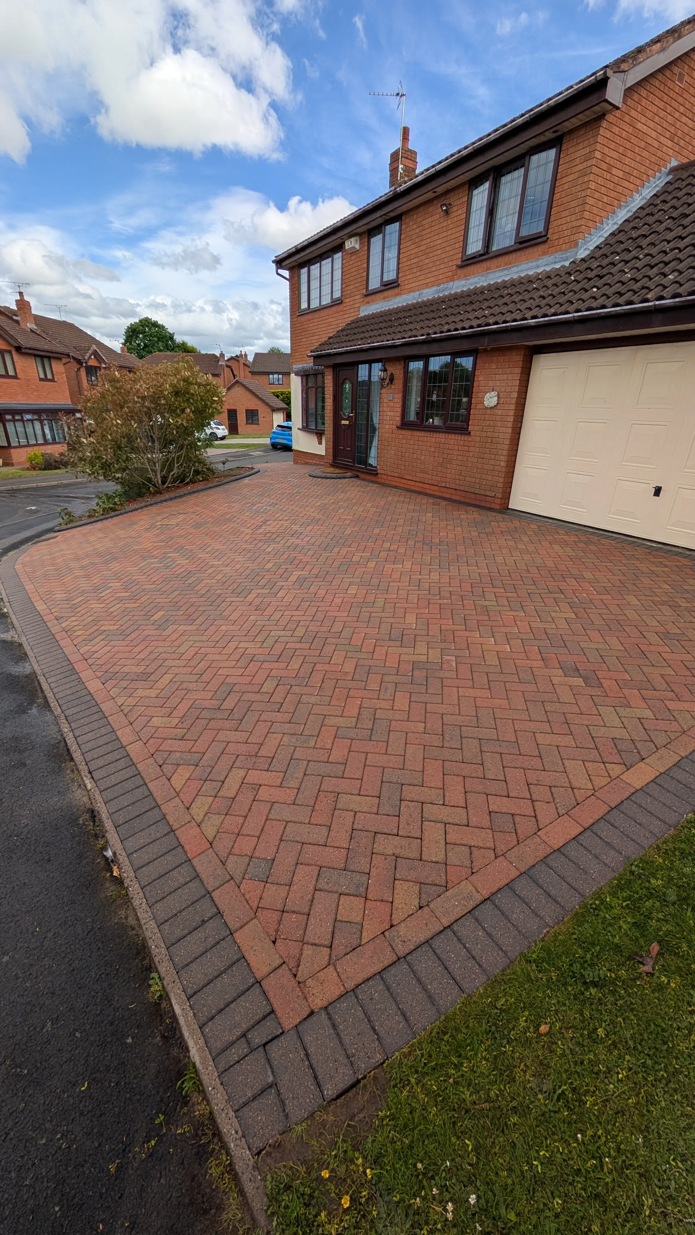 Block paved driveway after professional pressure washing