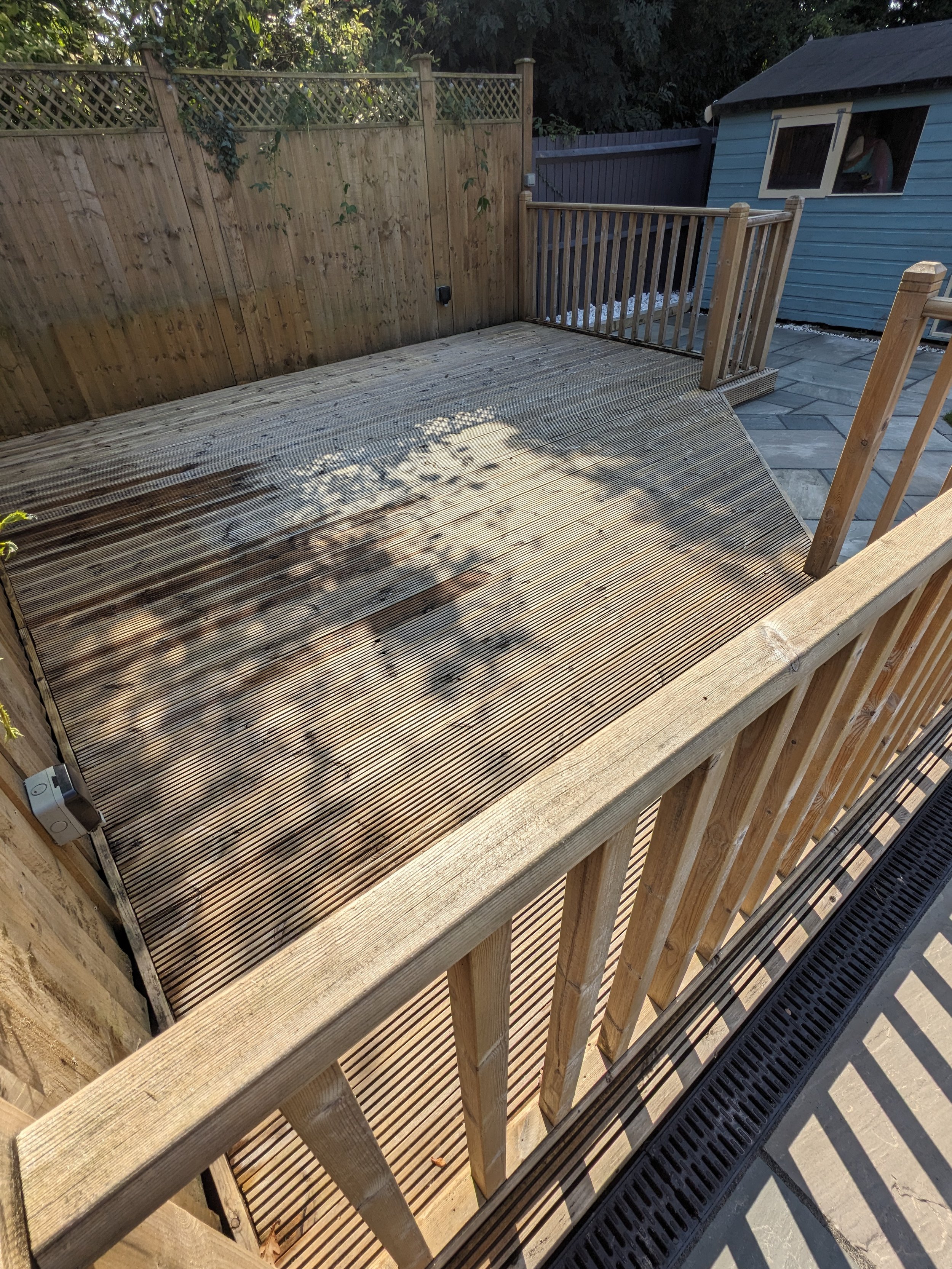Wooden decking cleaned and restored at residential property
