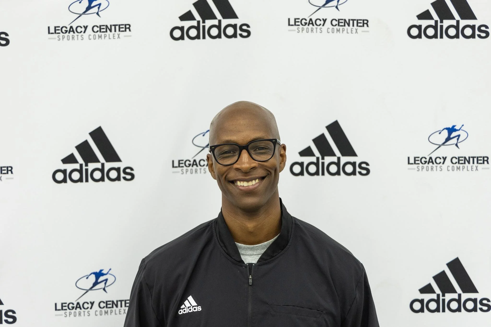 Silhouette of a young man with short hair against a white background, facing forward.