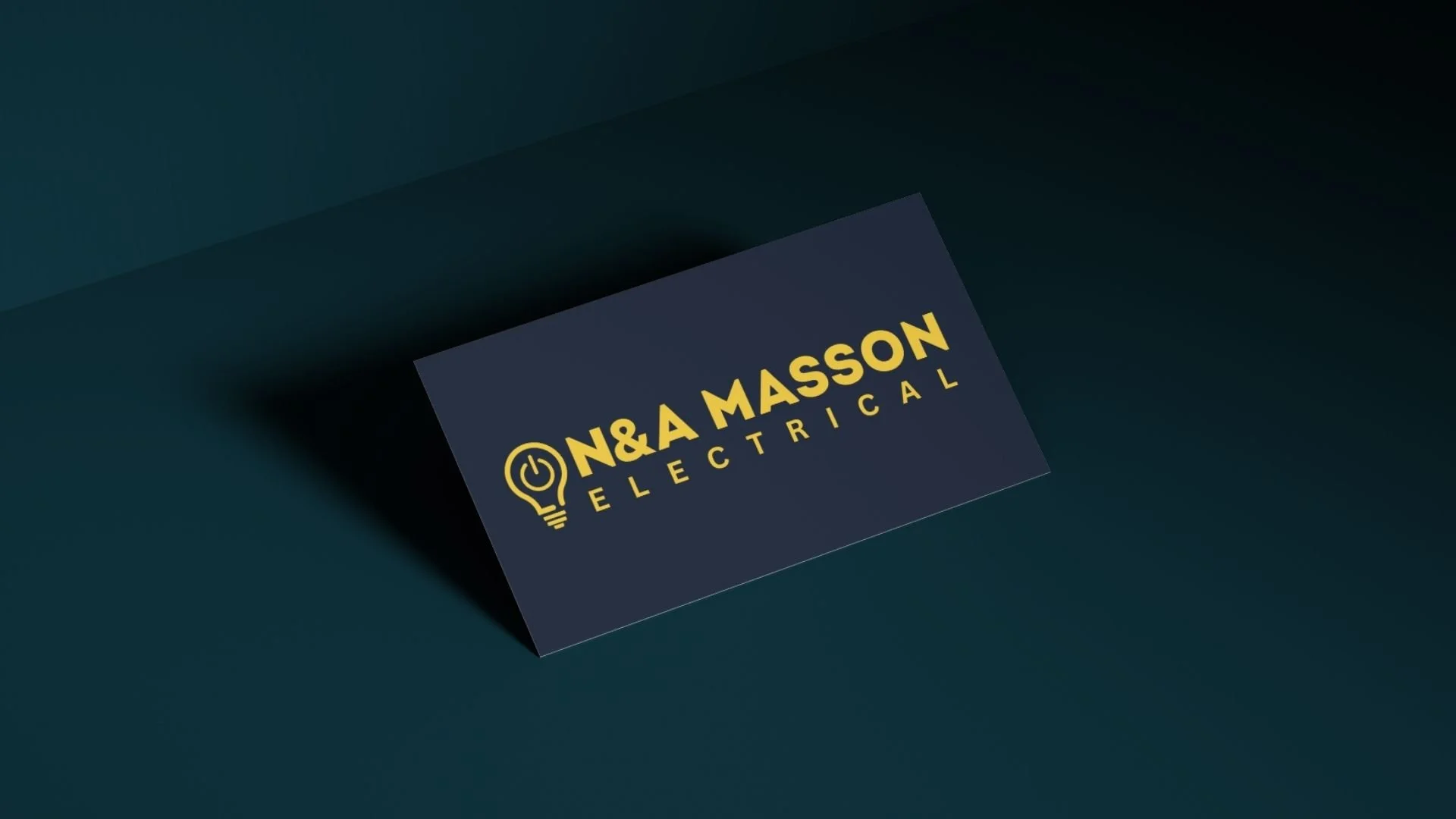Business card for N&A Masson Electrical with a yellow light bulb and power symbol on a dark background.