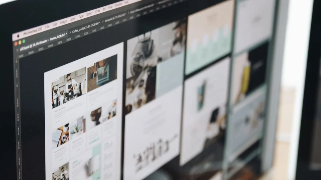 Close-up of computer screen displaying a graphic design or multimedia editing software with multiple project thumbnails.